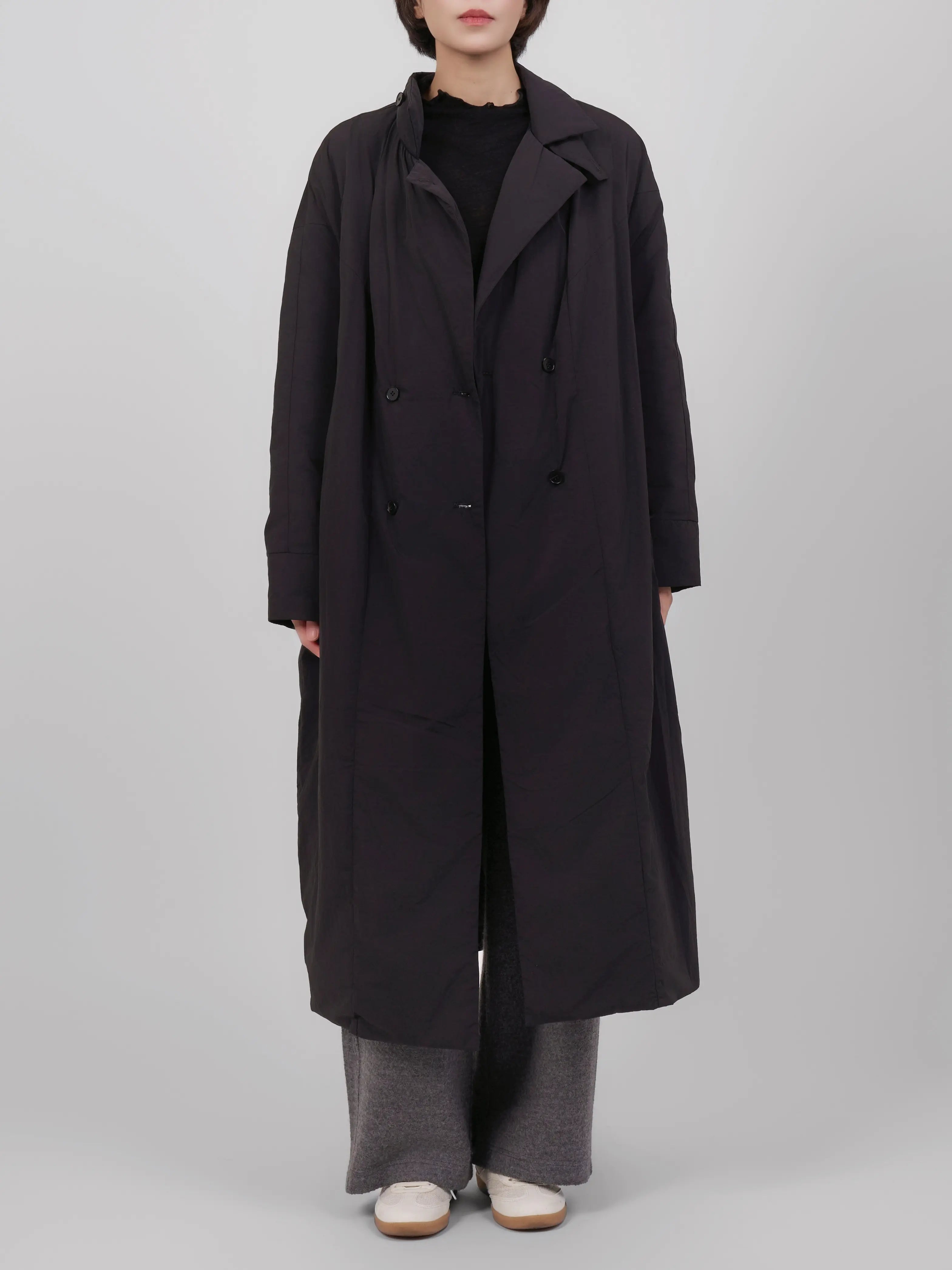 Full front outfit with black down coat styled in a neutral, everyday look.