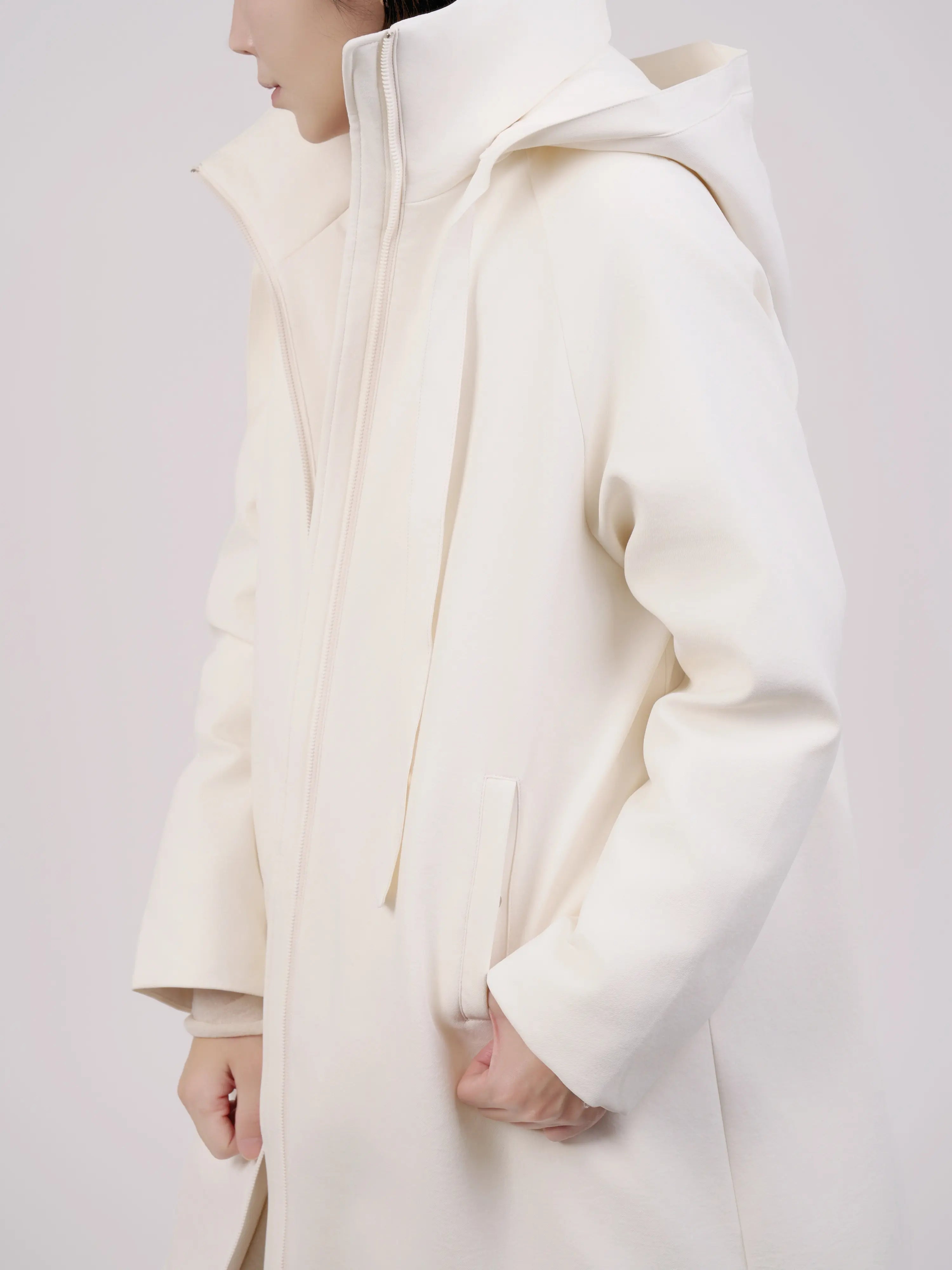 Sleeve detail showing fabric texture and minimal finishing.