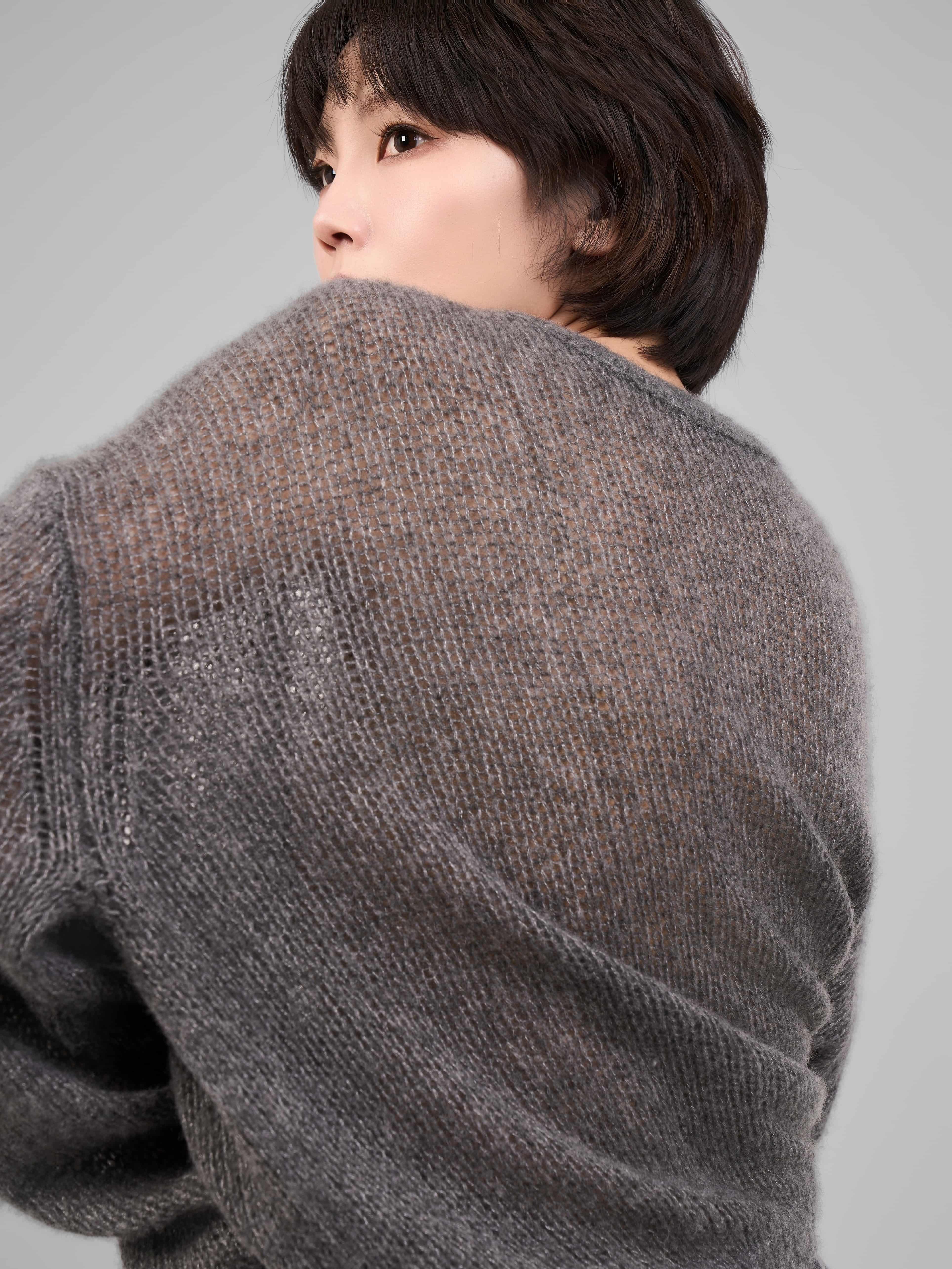 Back detail view of grey cashmere-silk knit showing soft fiber texture.