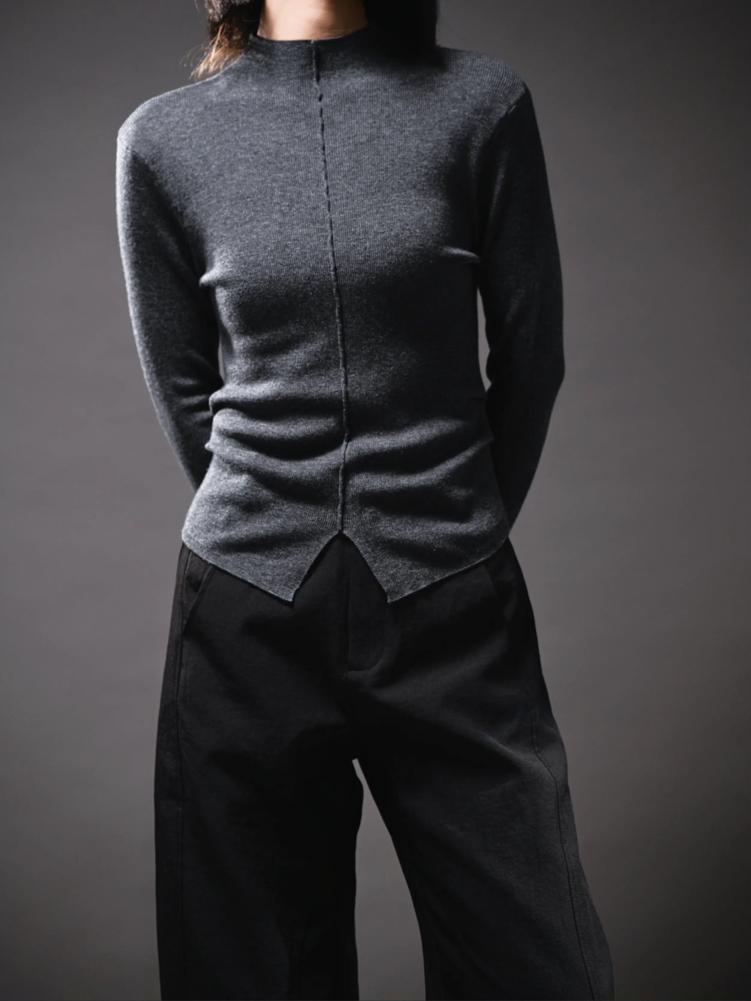 Studio shot of grey Early Spring Wool Top, soft structure, clean neckline, minimal seasonal knitwear.