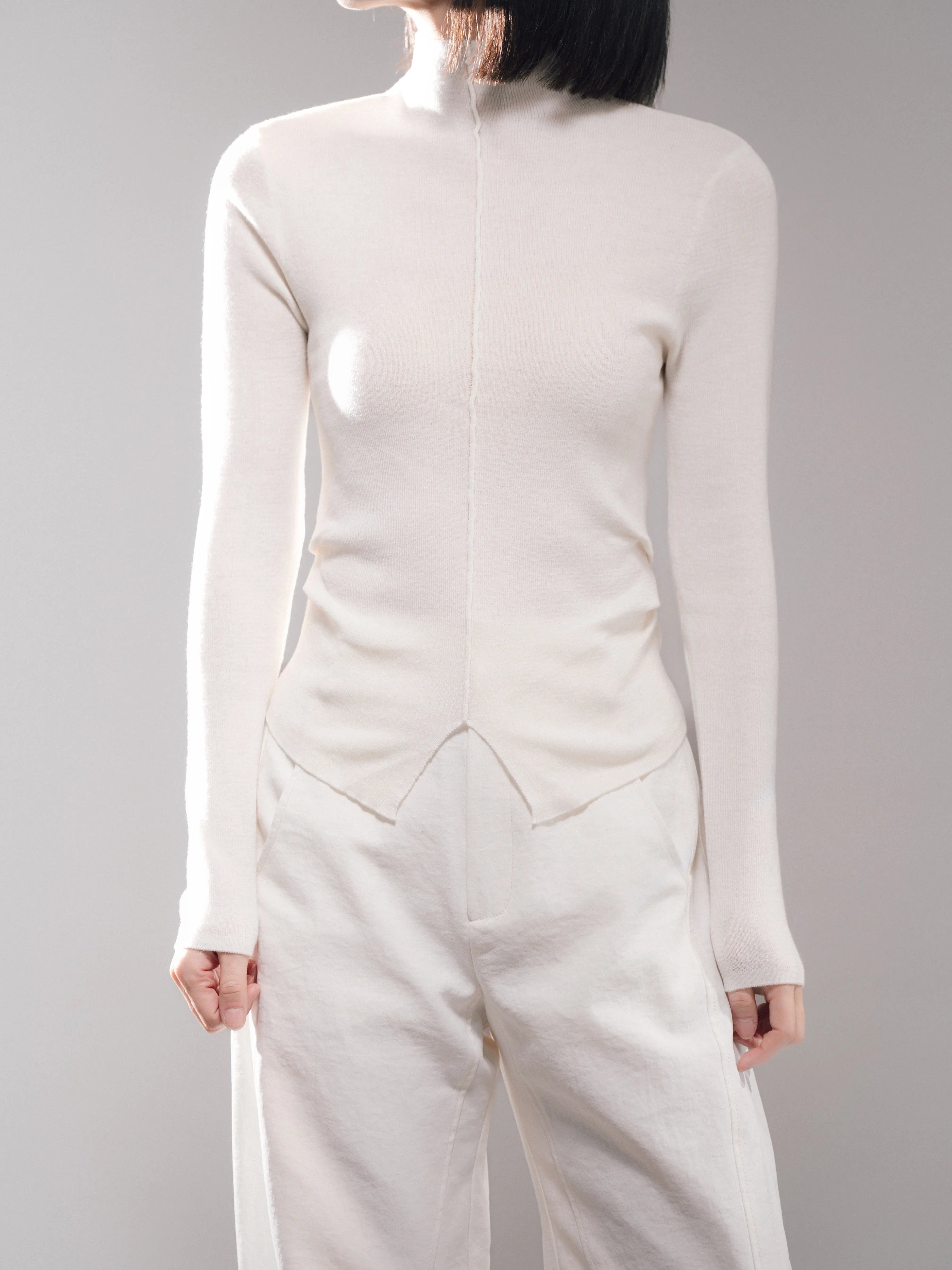 Front view of white Early Spring Wool Top, clean slim cut, soft wool blend knit, minimal spring styling for daily wear.
