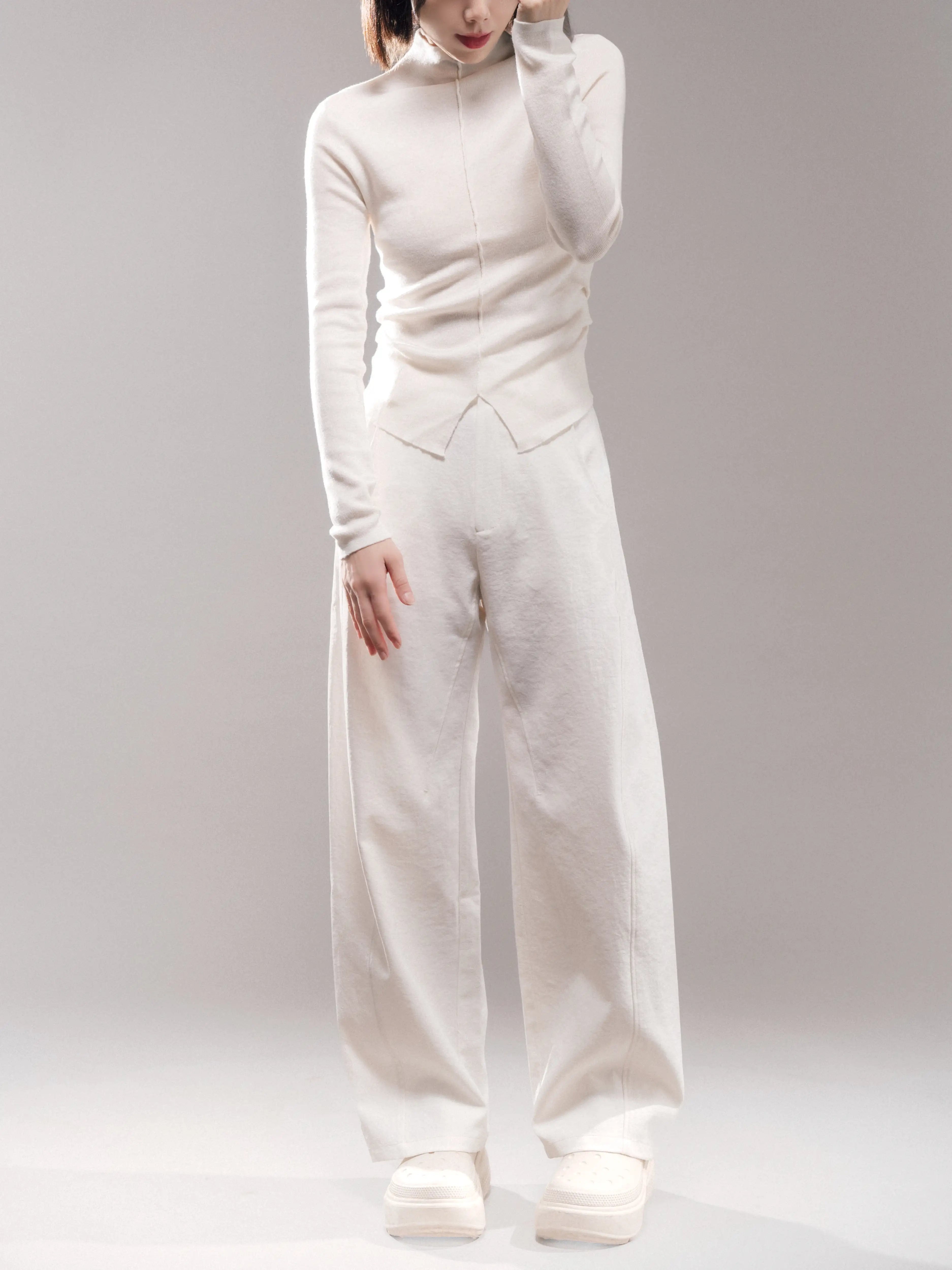 Full body outfit wearing white Early Spring Wool Top with matching trousers, breathable wool blend, relaxed spring styling.