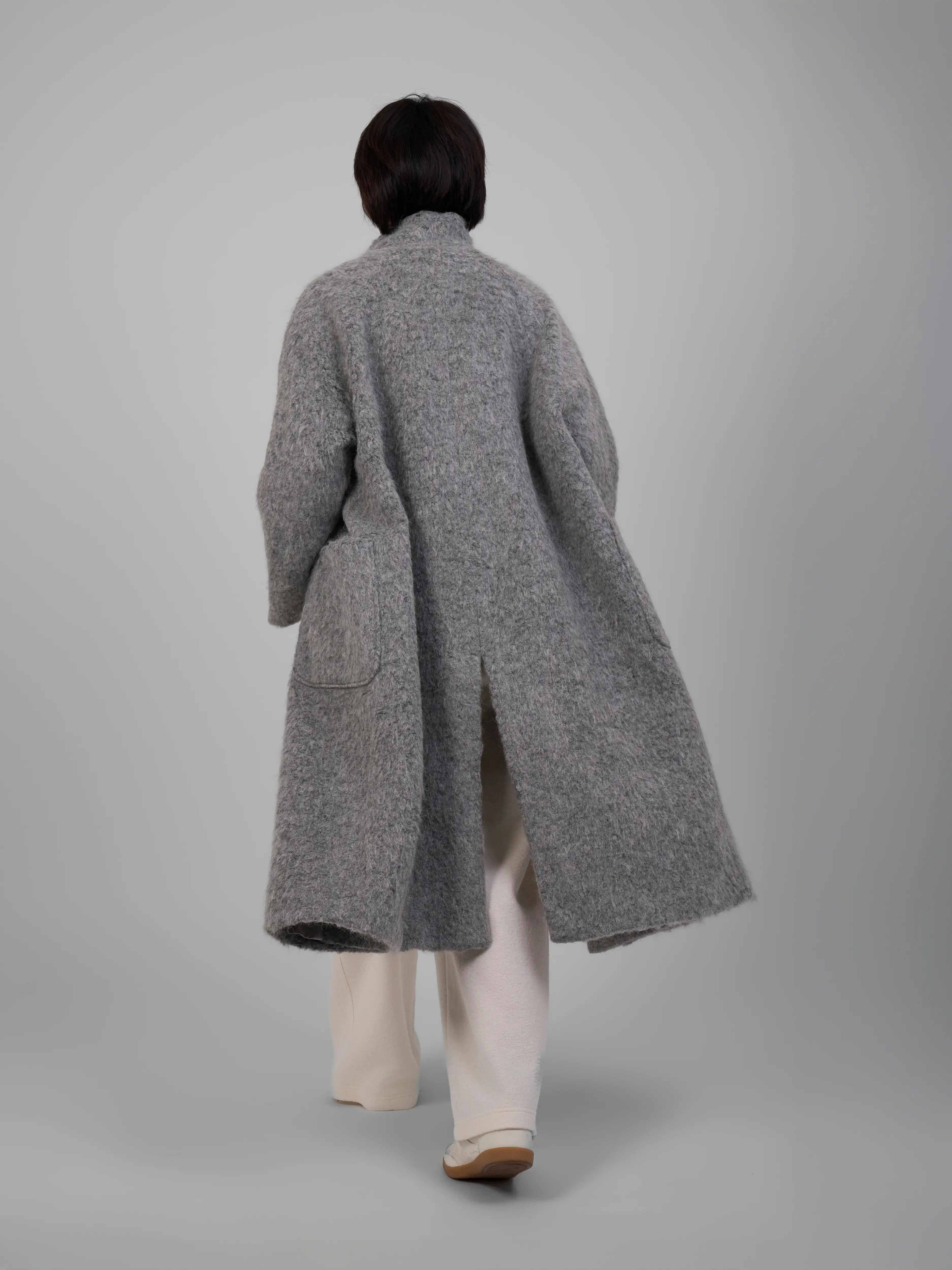 Back view of XXLSMILE Grey Wool Toggle Coat showing long-line silhouette and smooth wool finish.