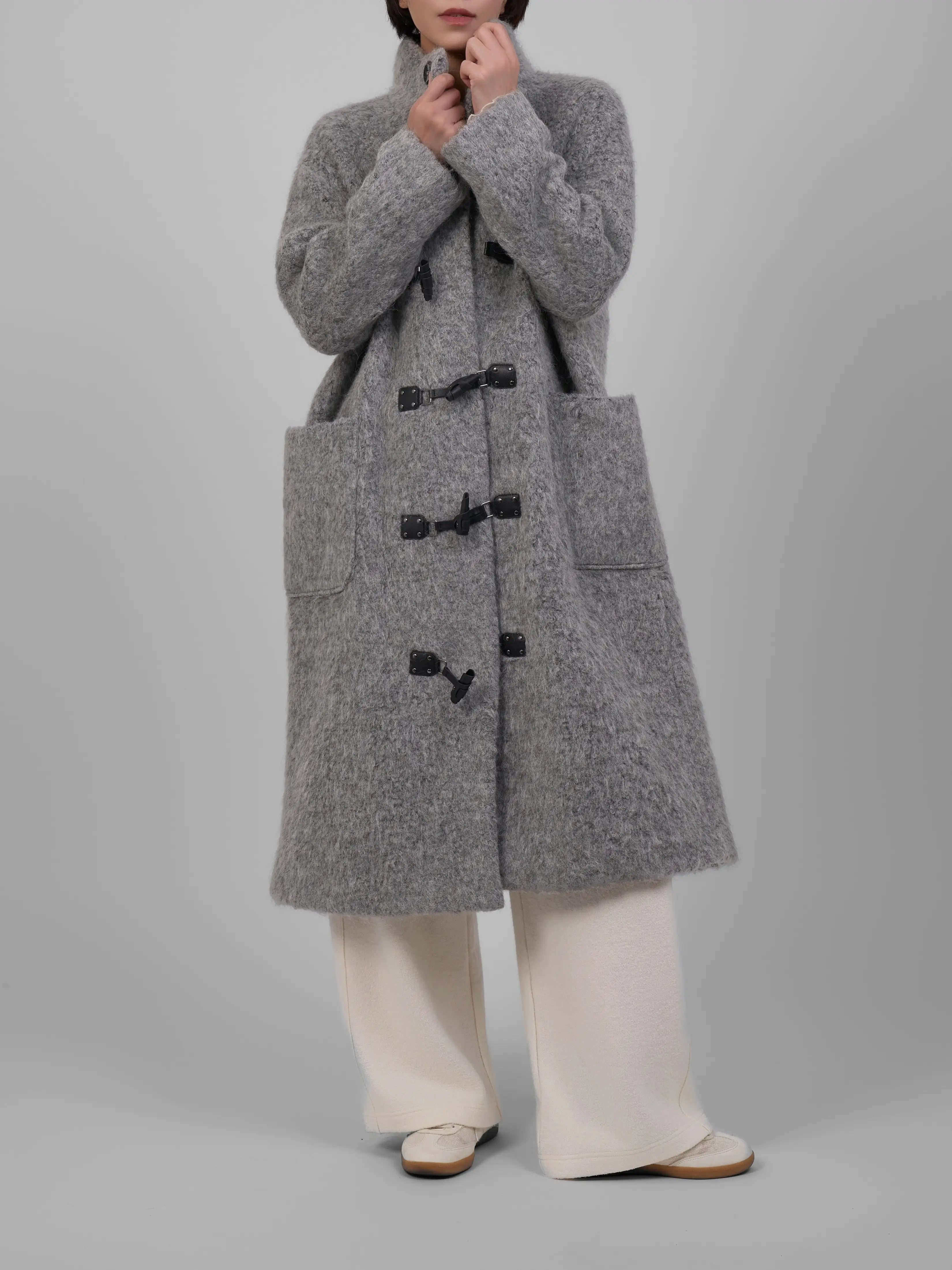 Close-up front detail of XXLSMILE Grey Wool Toggle Coat with toggle buttons and soft wool texture.