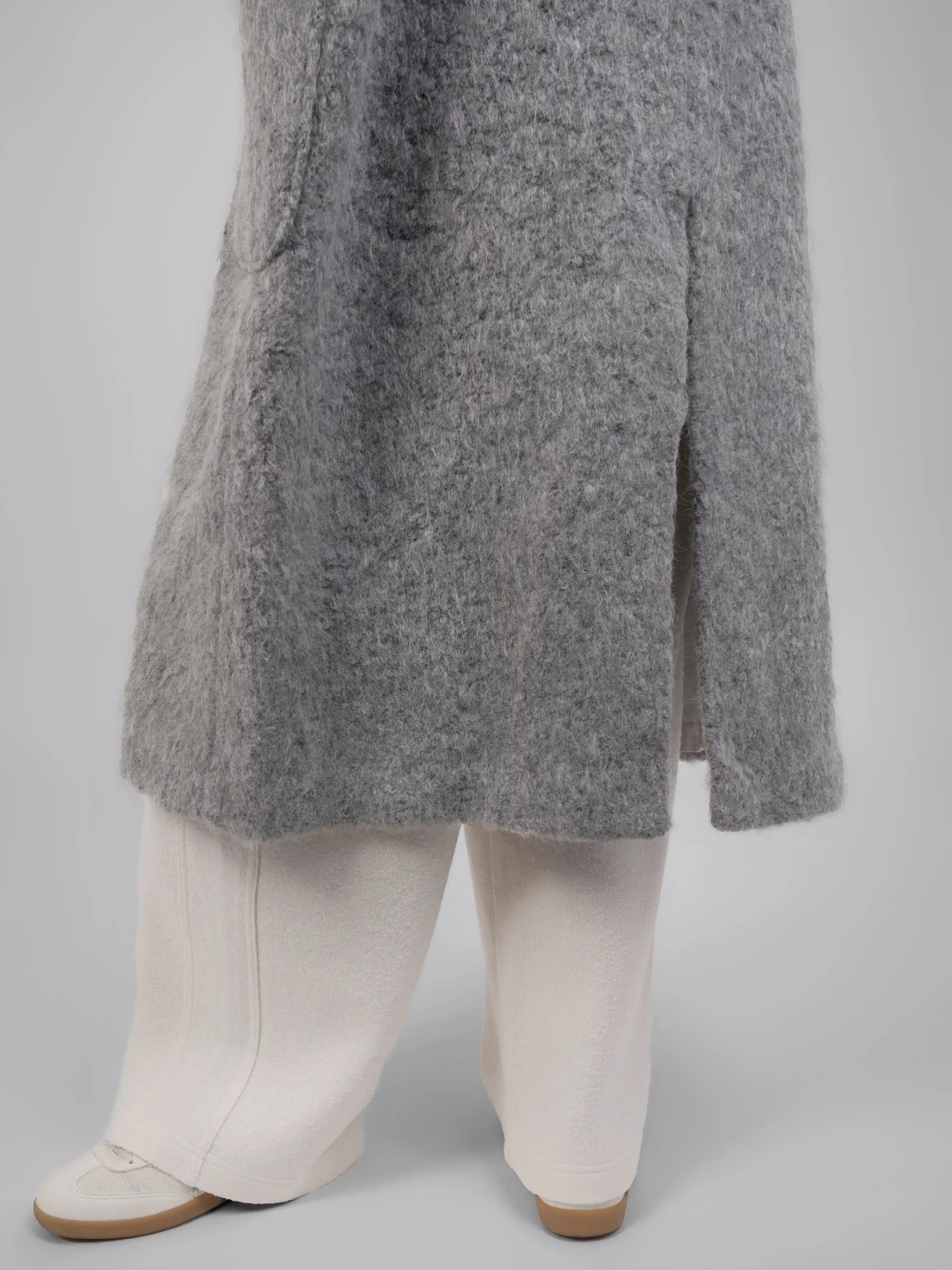 Hem detail showing texture, weight and subtle structure.