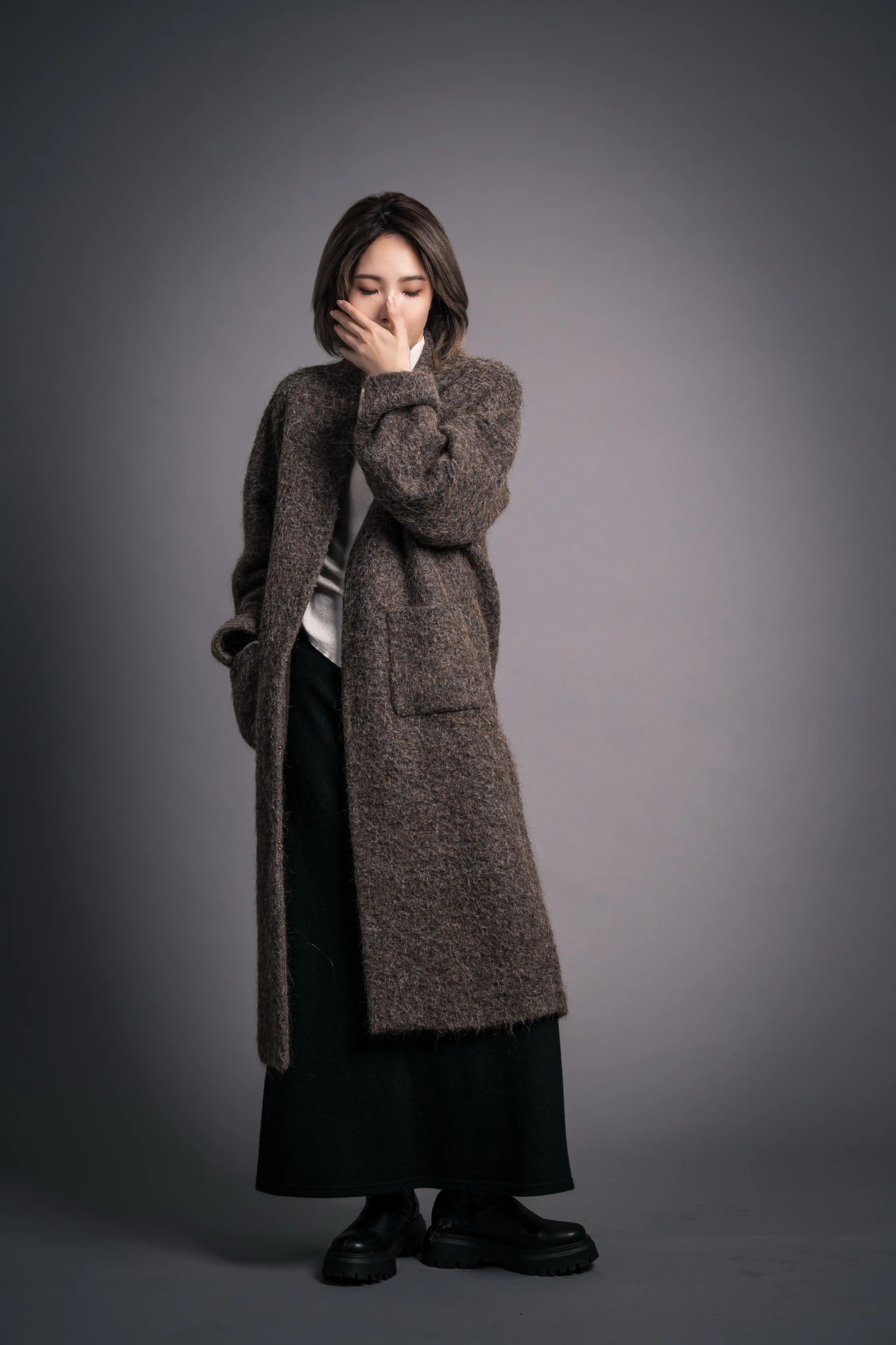 Front view of Mocha Wool Coat, collarless minimal design and clean structure