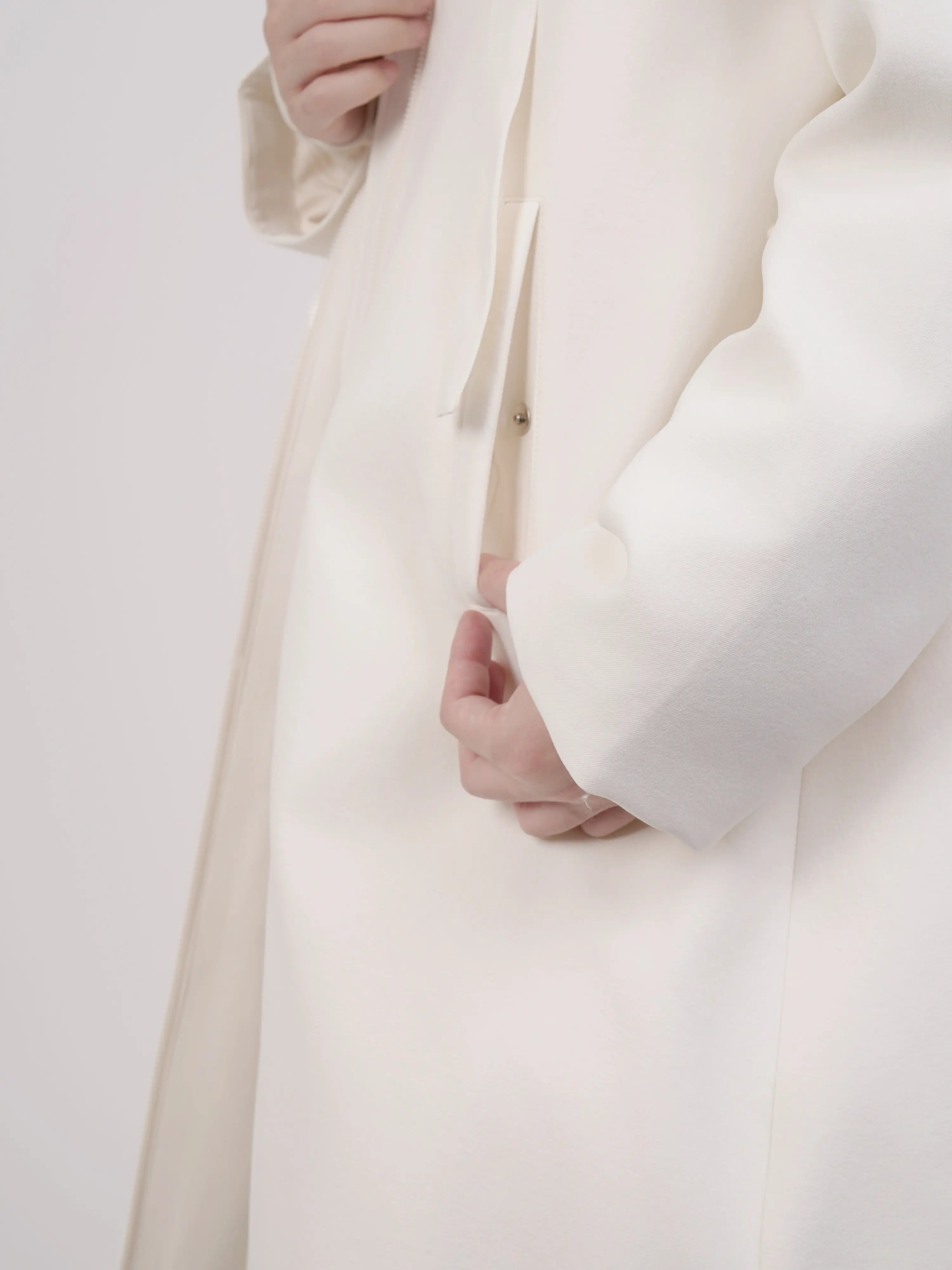 Close-up of collar and hood design with clean construction.