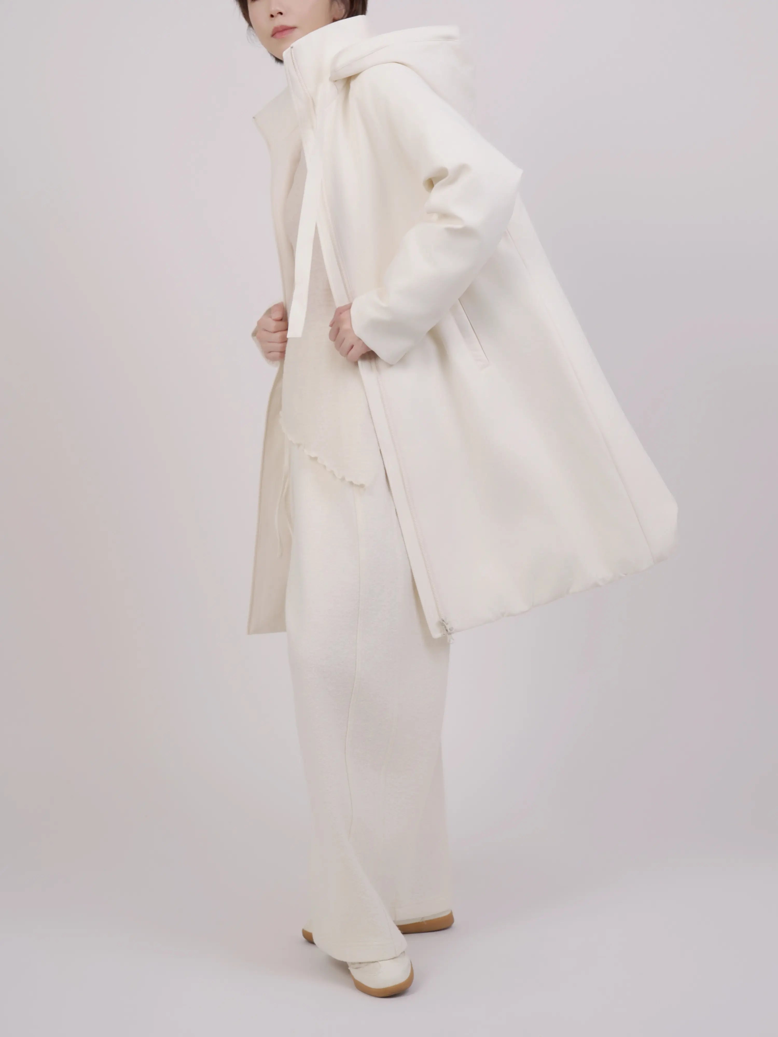 Side movement view showing drape and natural volume while walking.