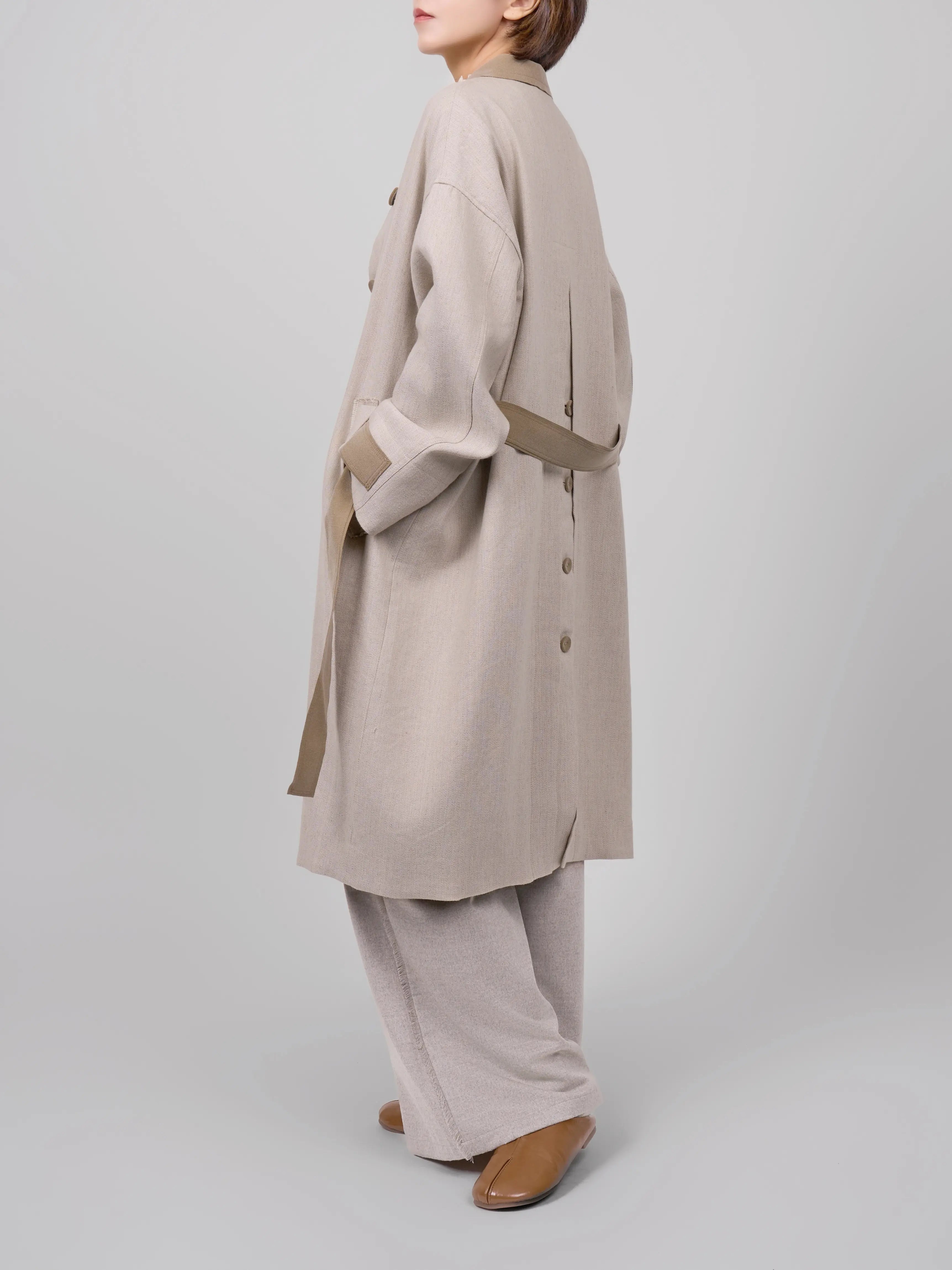 Side walking view showing movement, drape and fabric texture.