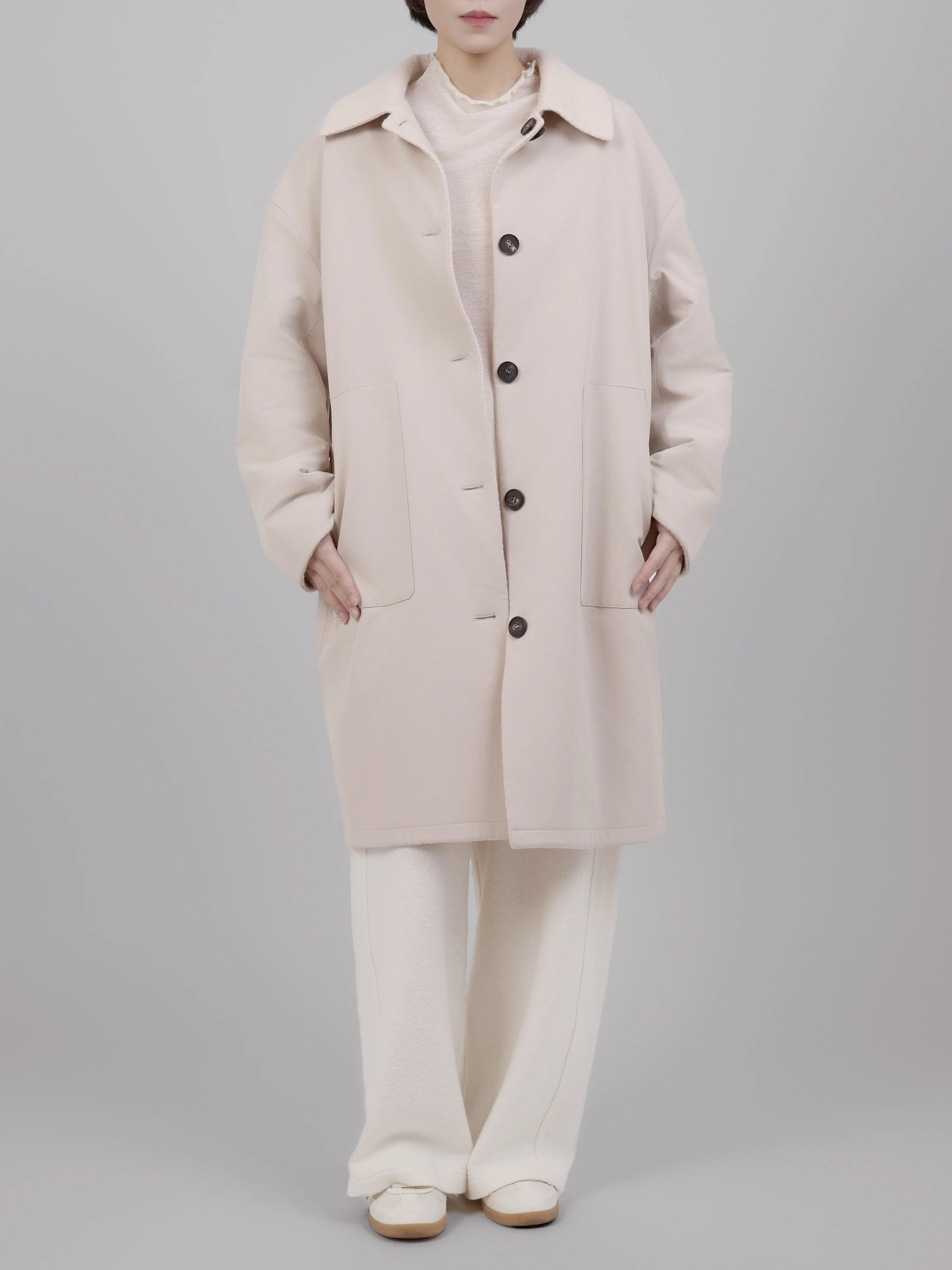 Full front outfit featuring reversible wool coat paired with neutral tones for a refined everyday look.