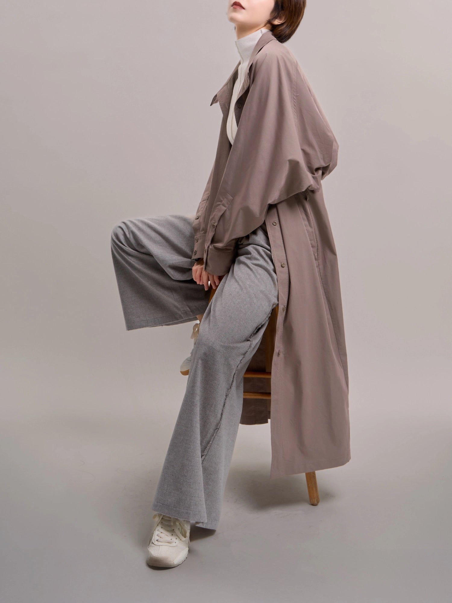 Ripple Trench in motion, showing fluid drape and relaxed city layering.