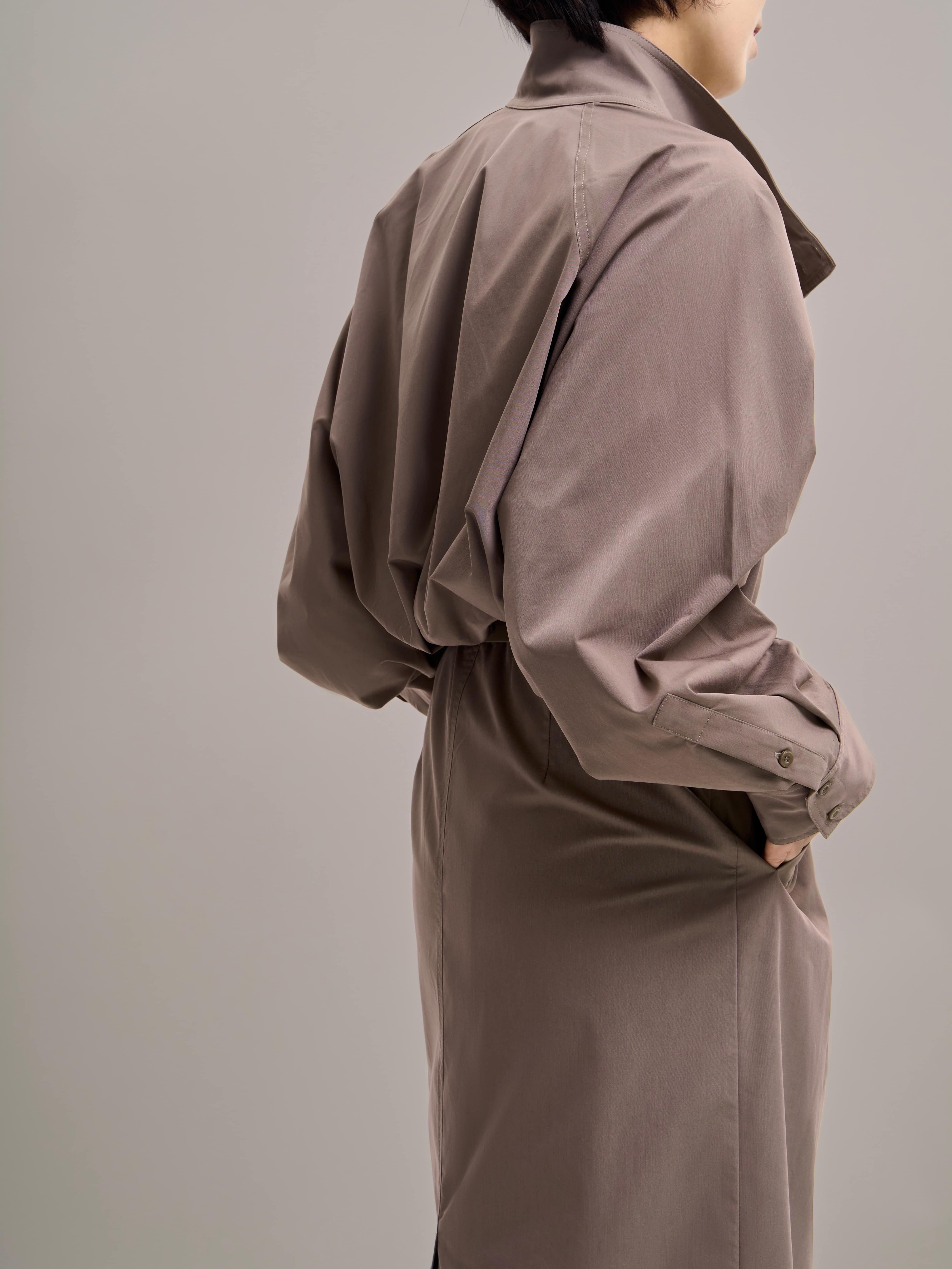 Side profile of Ripple Trench highlighting gathered back detail and shaped silhouette.