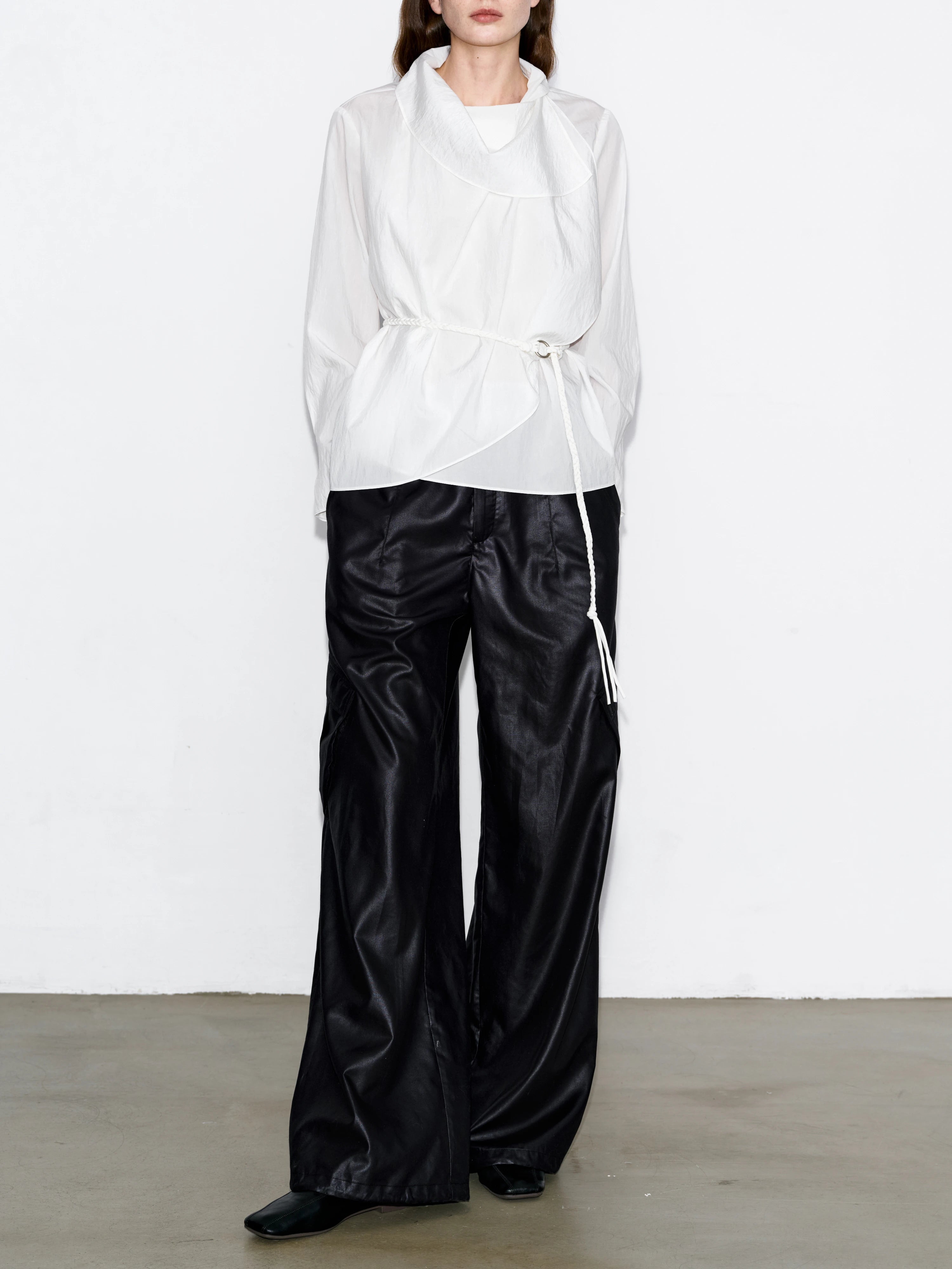 White Breeze Top with rope belt, lightweight Tencel-nylon blend, wide sleeves, clean minimalist drape, styled with black wide-leg trousers, modern casual outfit.