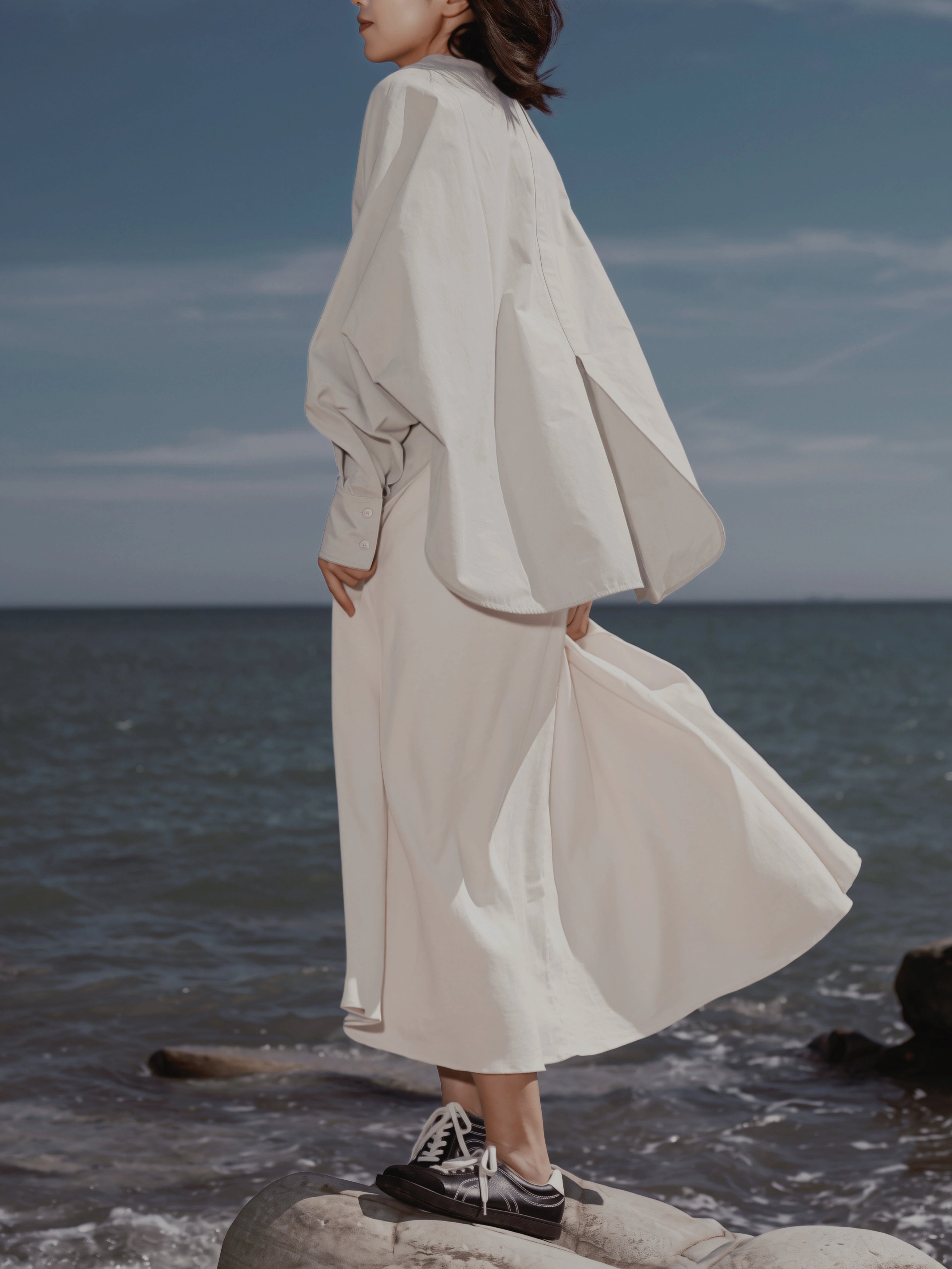 Back-side view of the Batwing Pullover in Sage featuring the oversized silhouette.