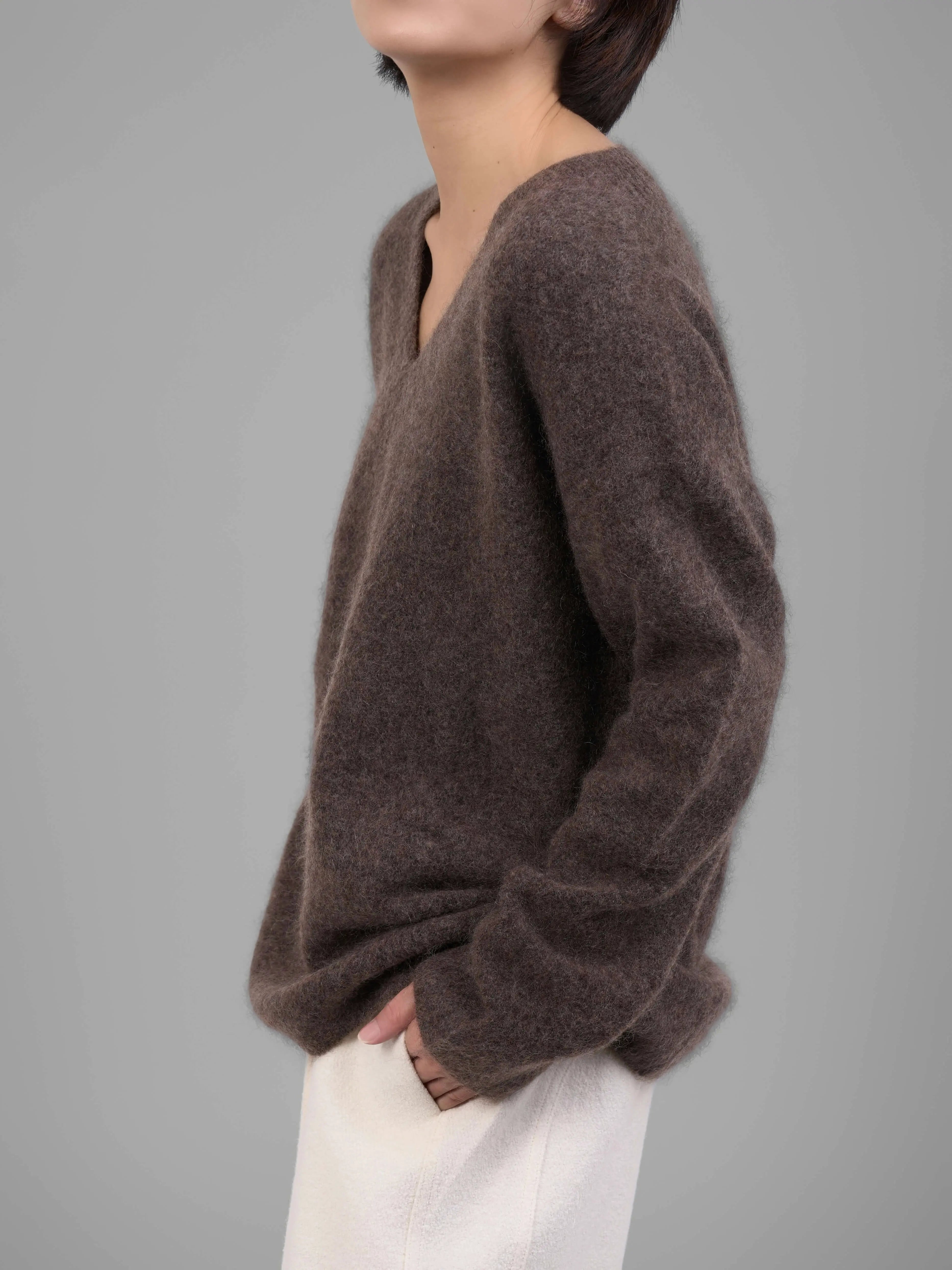 Brown V-neck mohair sweater front half-body view highlighting neckline
