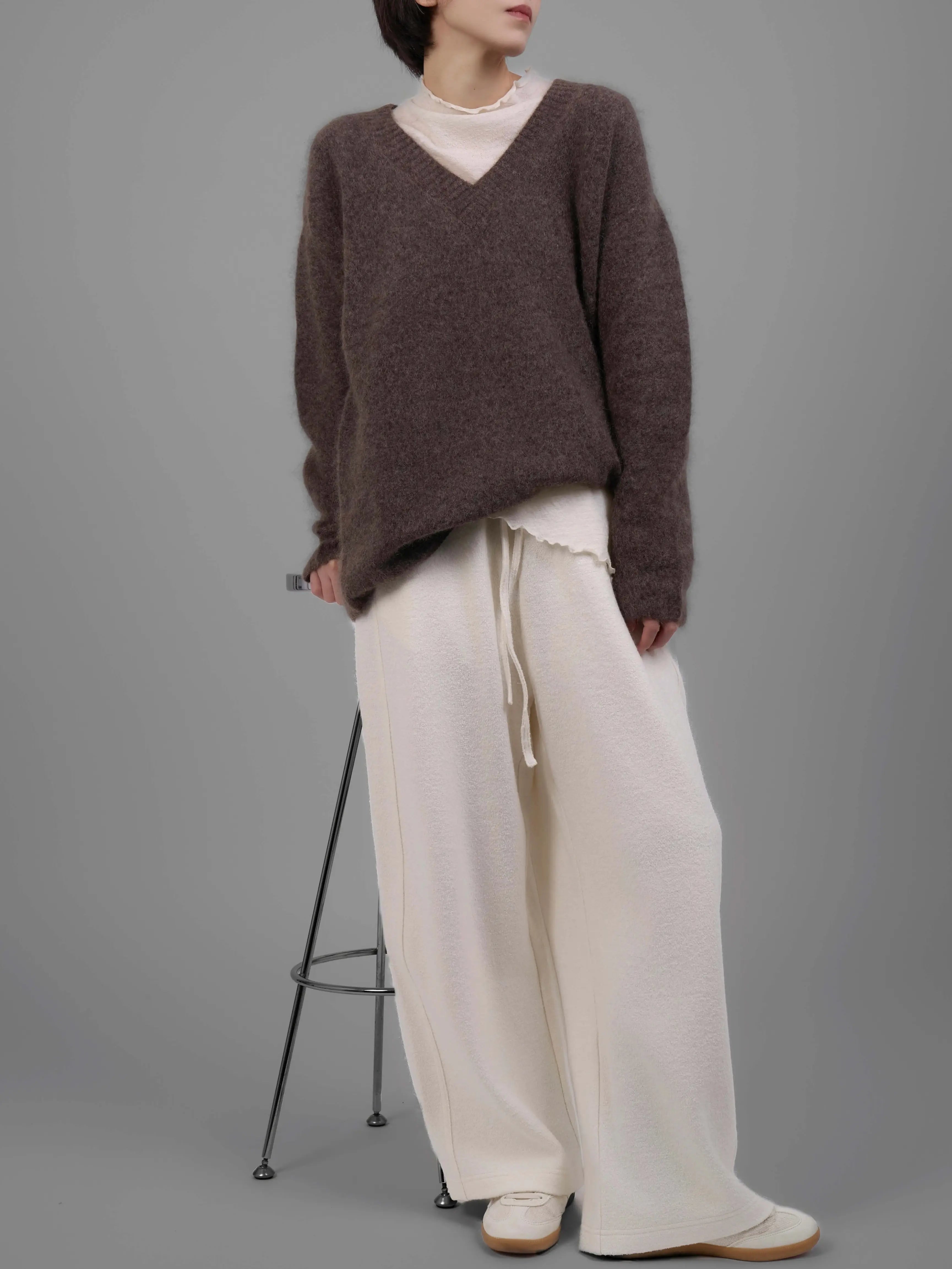 Brown V-neck mohair sweater side view showing relaxed fit