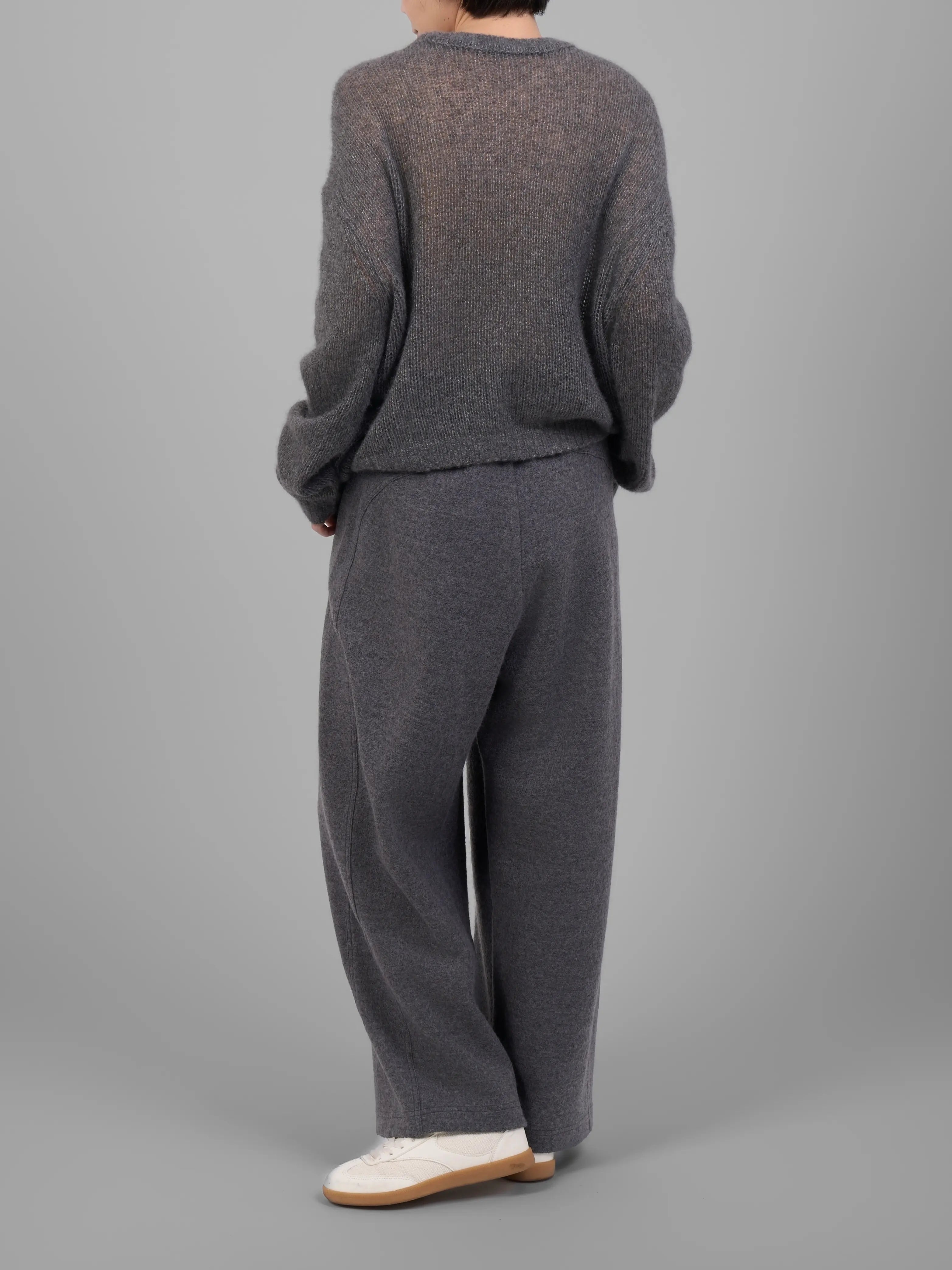 Back view of the grey cashmere-silk knit sweater showing relaxed drape.