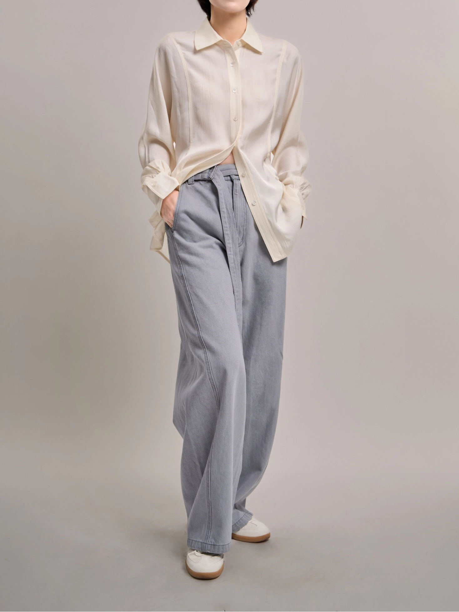 Front view of light blue Curved Cocoon Jeans showcasing gentle cocoon shape and relaxed drape.