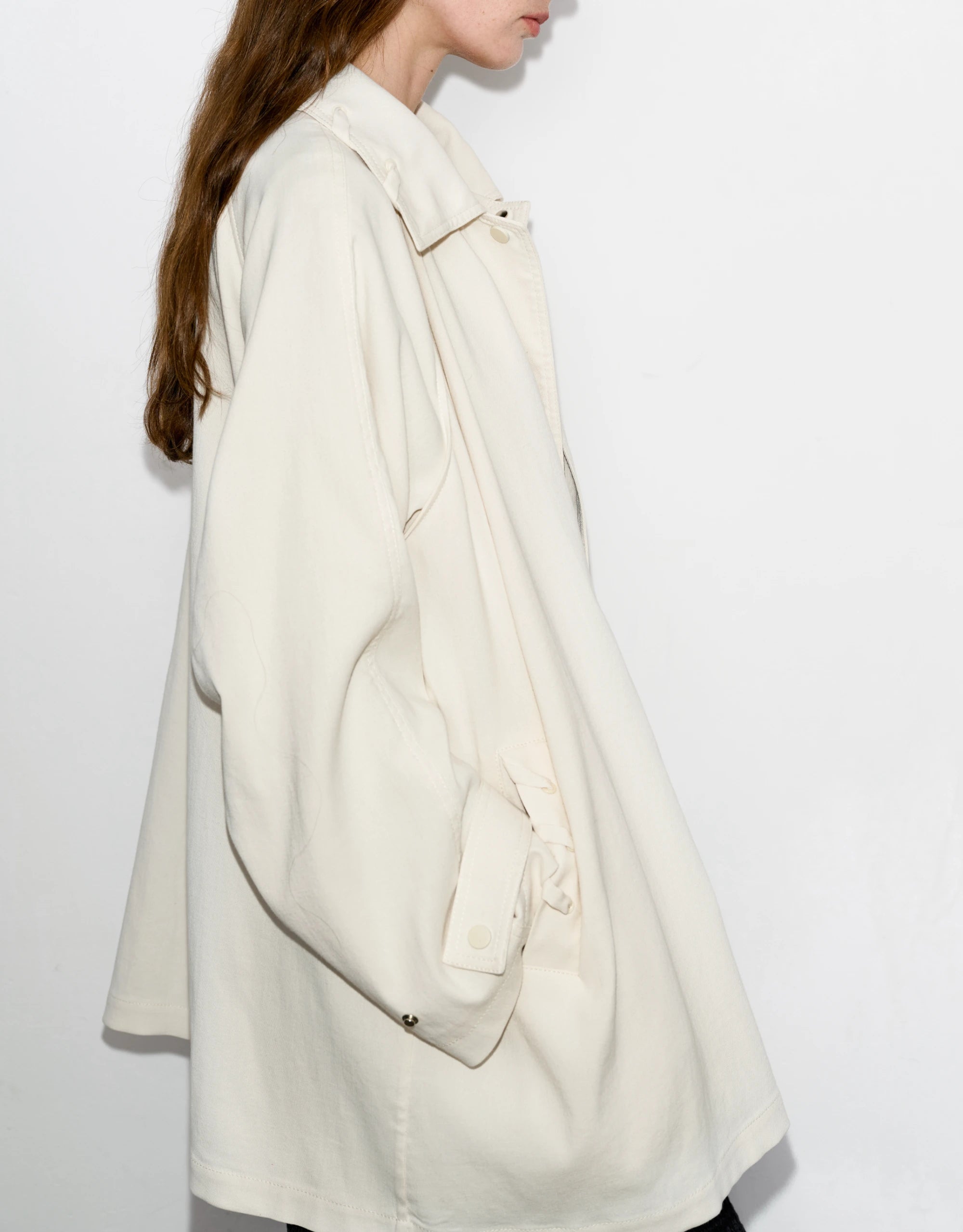 Back-angle look of Drift Overshirt, rounded sleeve volume with natural movement.