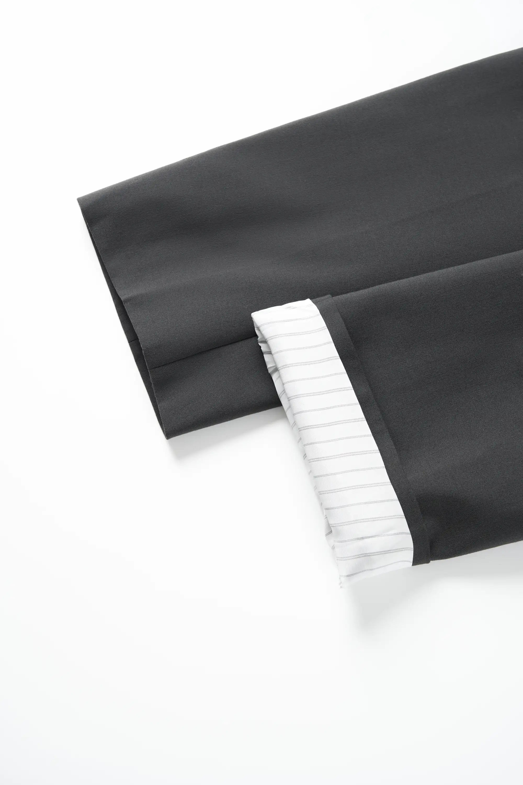 Close-up of the sleeve cuffs on the XXL Smile blazer, showing the fabric finish and hem.