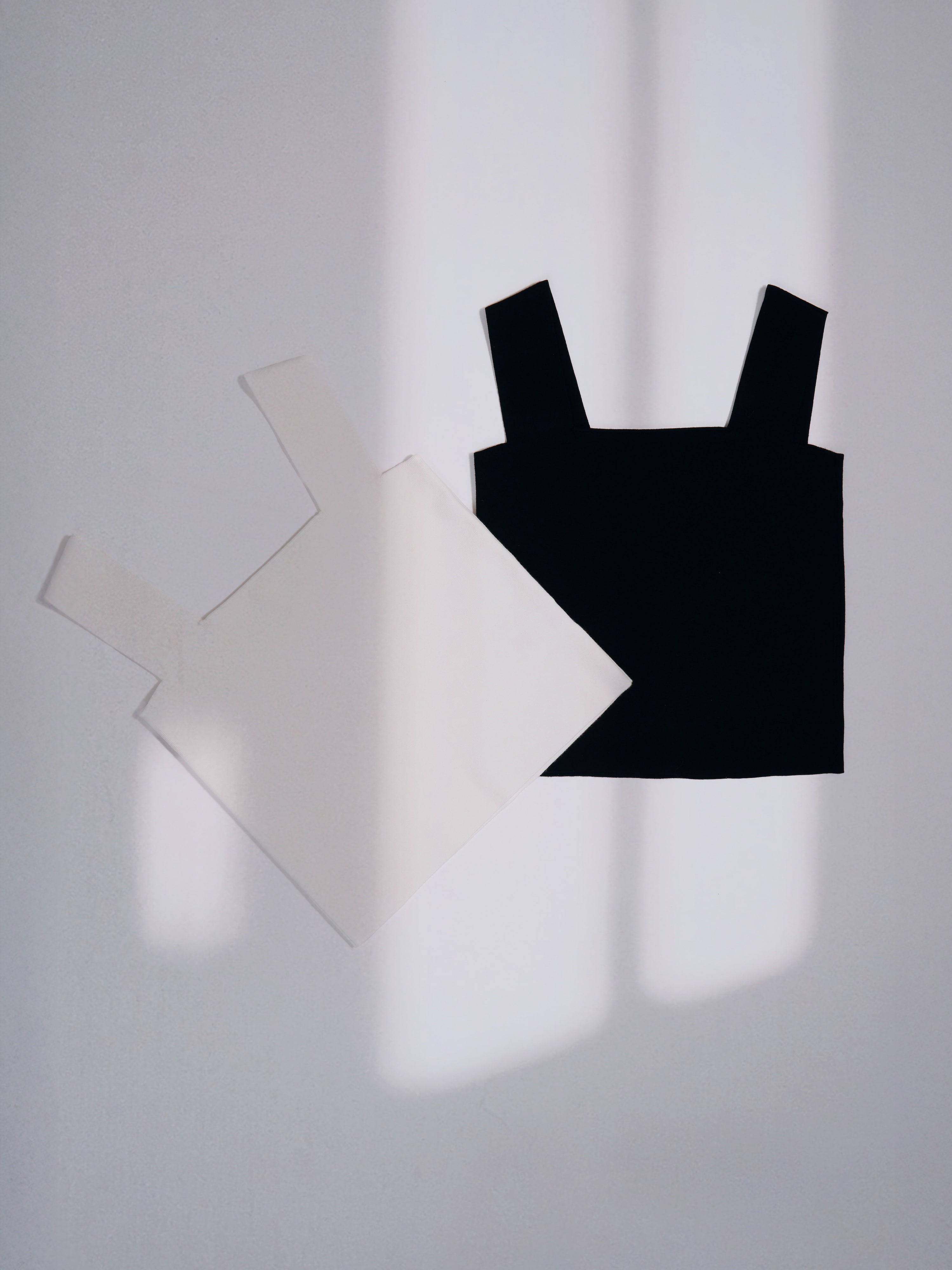Black Minimal Square Neck Shell displayed with soft natural shadows.