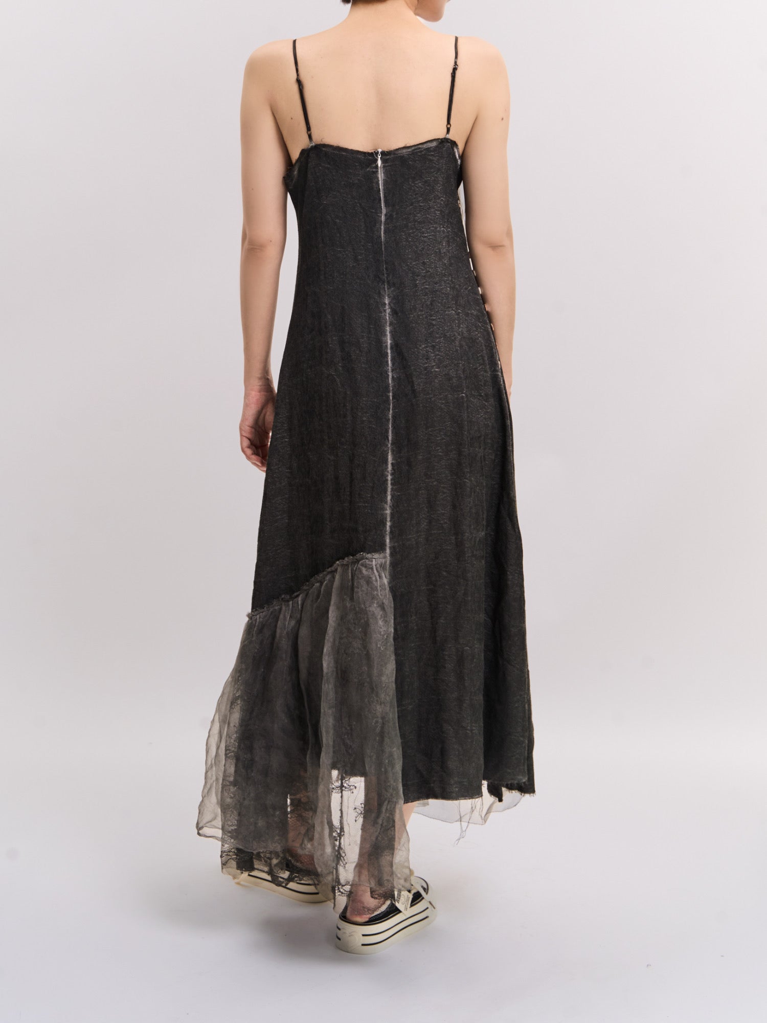 Back view of Mist Veil Dress showing clean straps, layered hem and soft structural drape.
