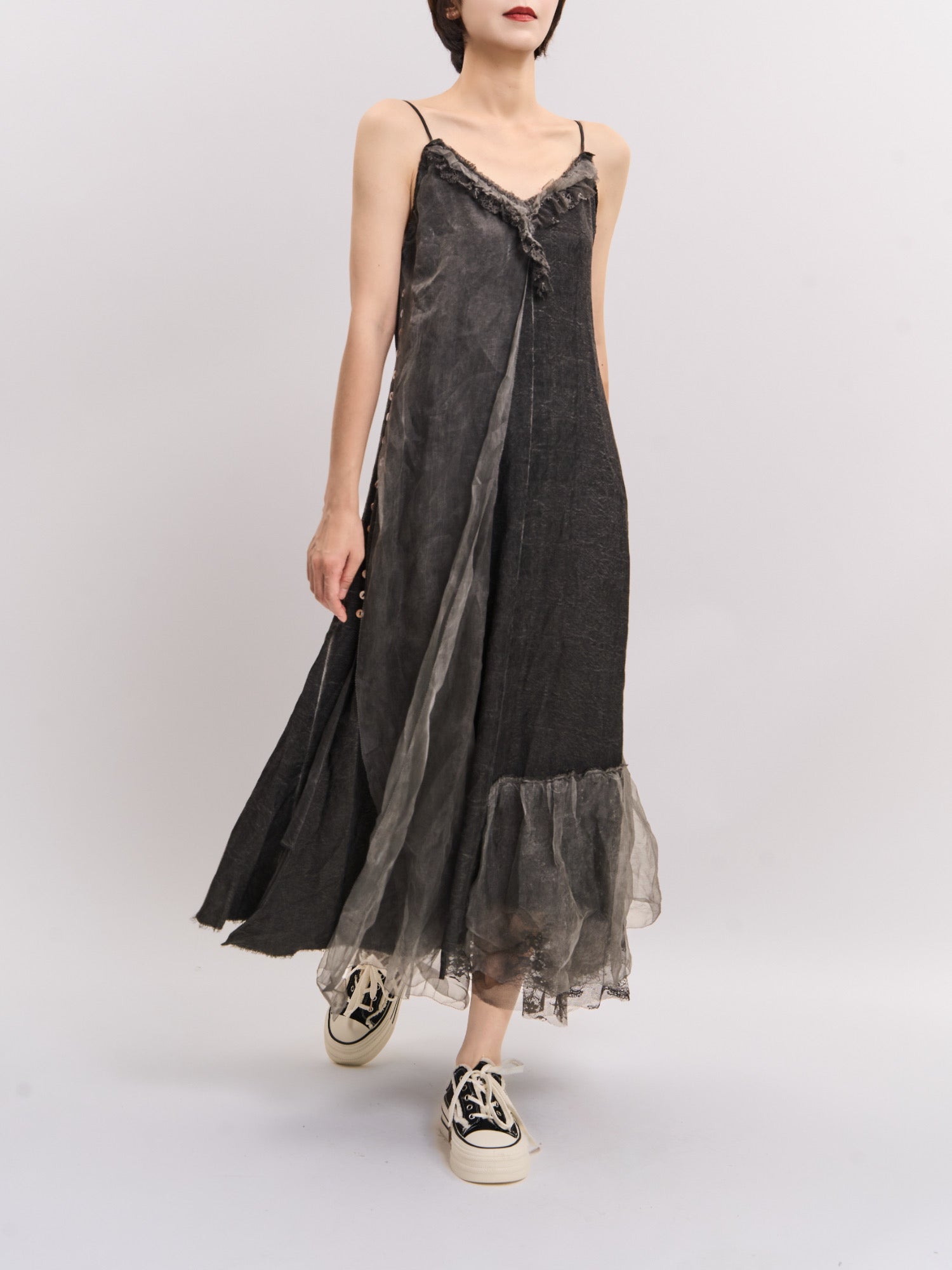 Left-angle front view of Mist Veil Dress showing natural movement and flowing layered hemline.