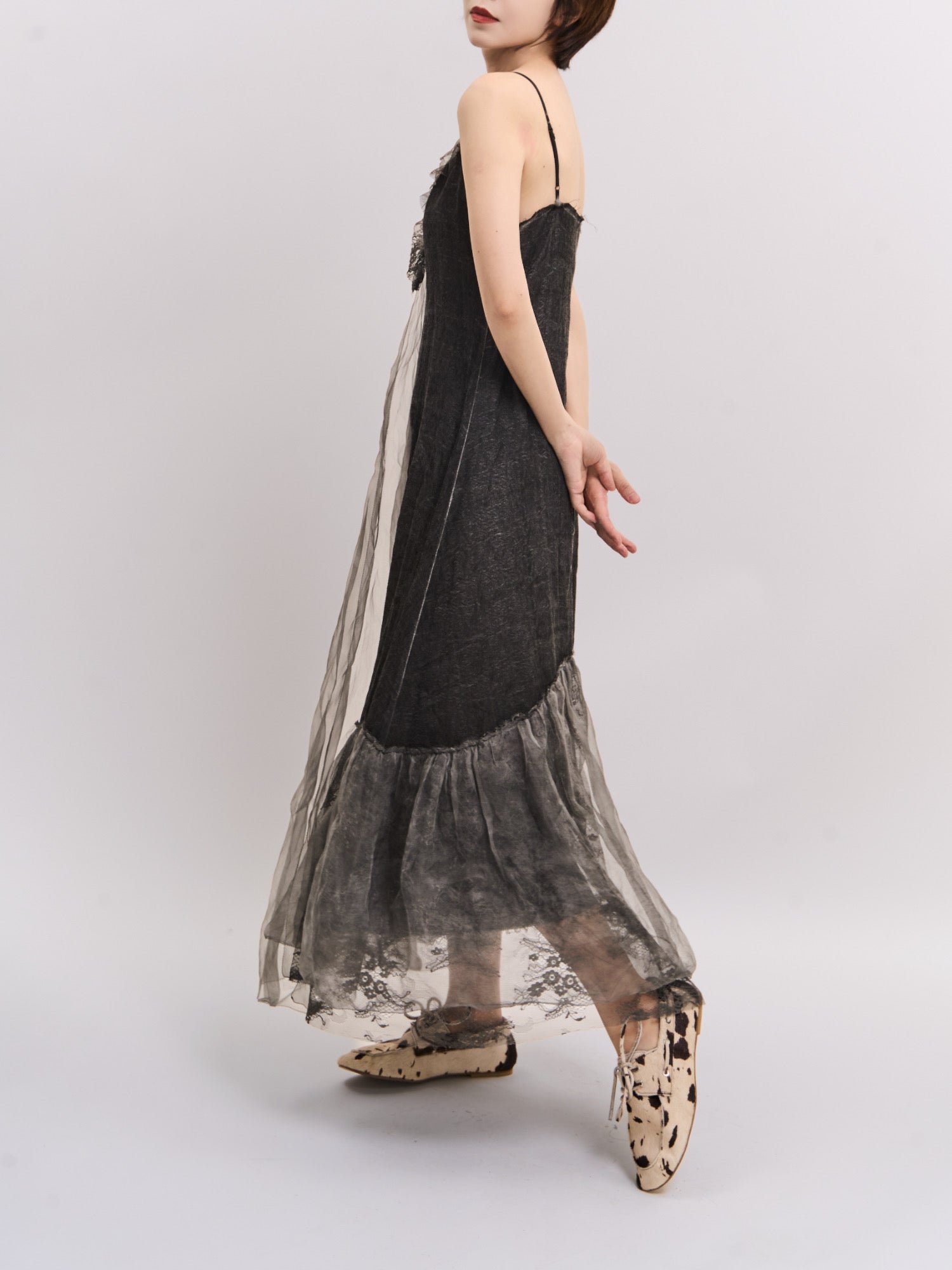 Side-back angle of Mist Veil Dress showing flowing movement and sheer mulberry silk finish.