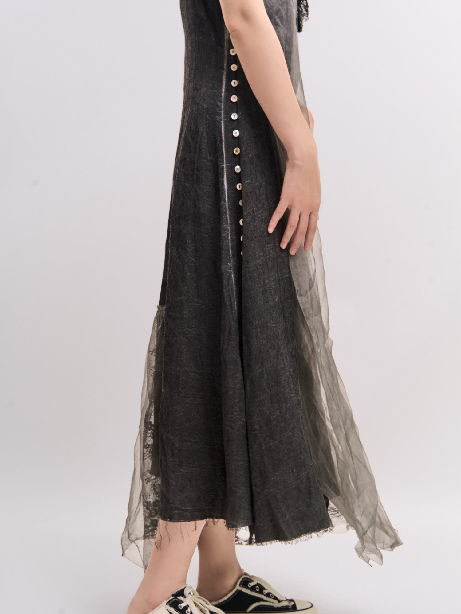 Side view of Mist Veil Dress highlighting modern side-button detail and mulberry silk overlay.