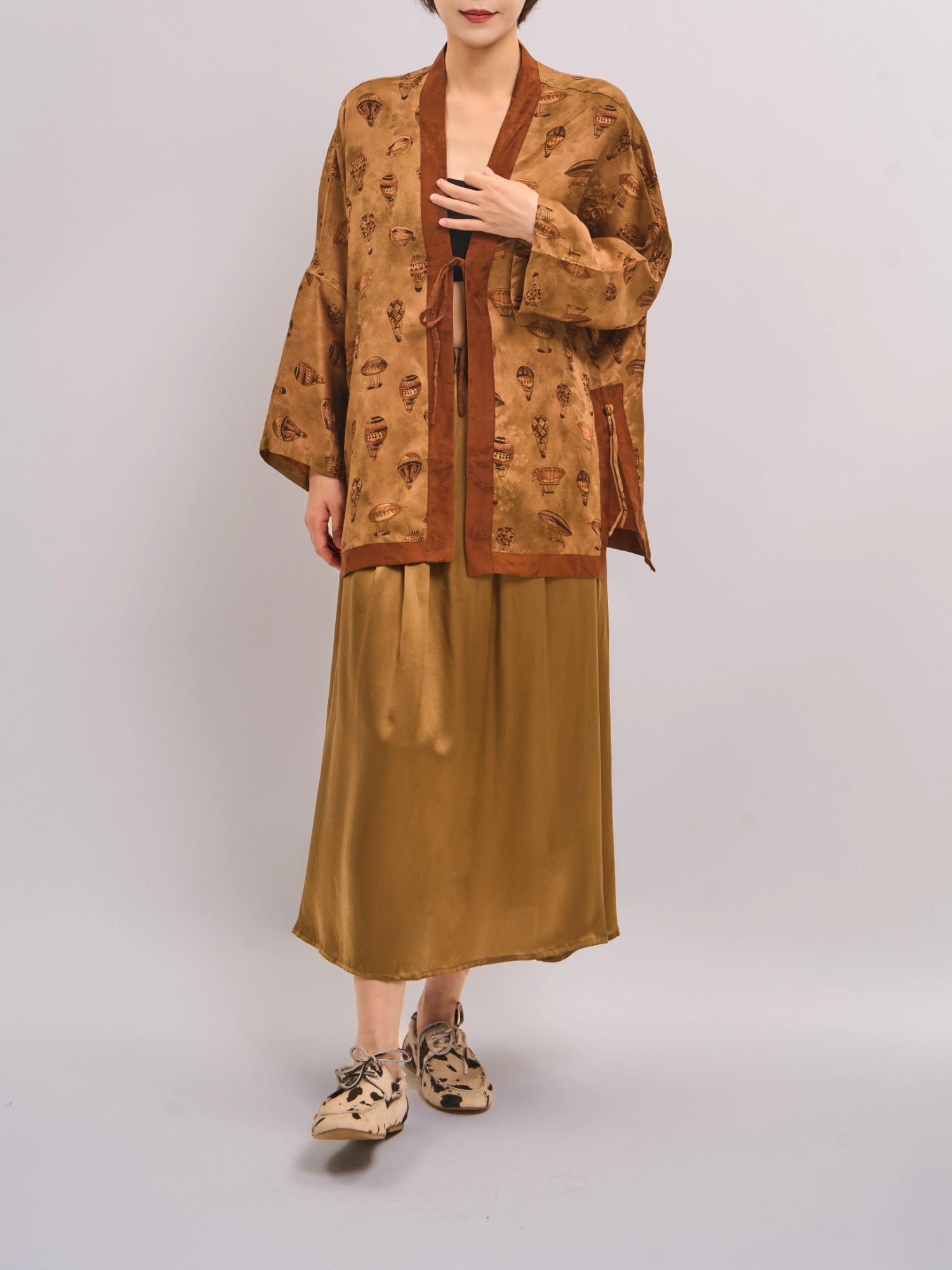 Front view of bronze mulberry silk Xiangyunsha top, showing jacquard texture and relaxed open silhouette.