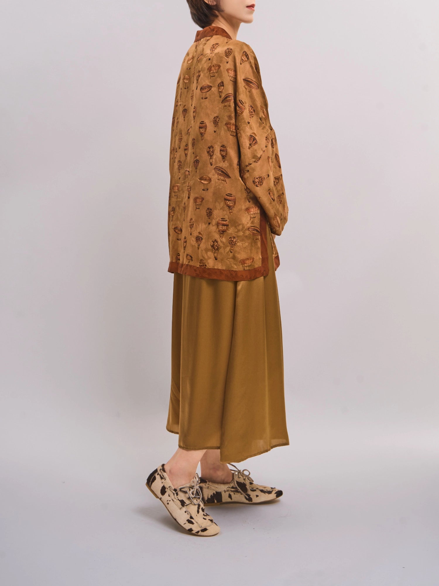 Side view of mulberry silk Xiangyunsha top highlighting fluid drape and lightweight movement.
