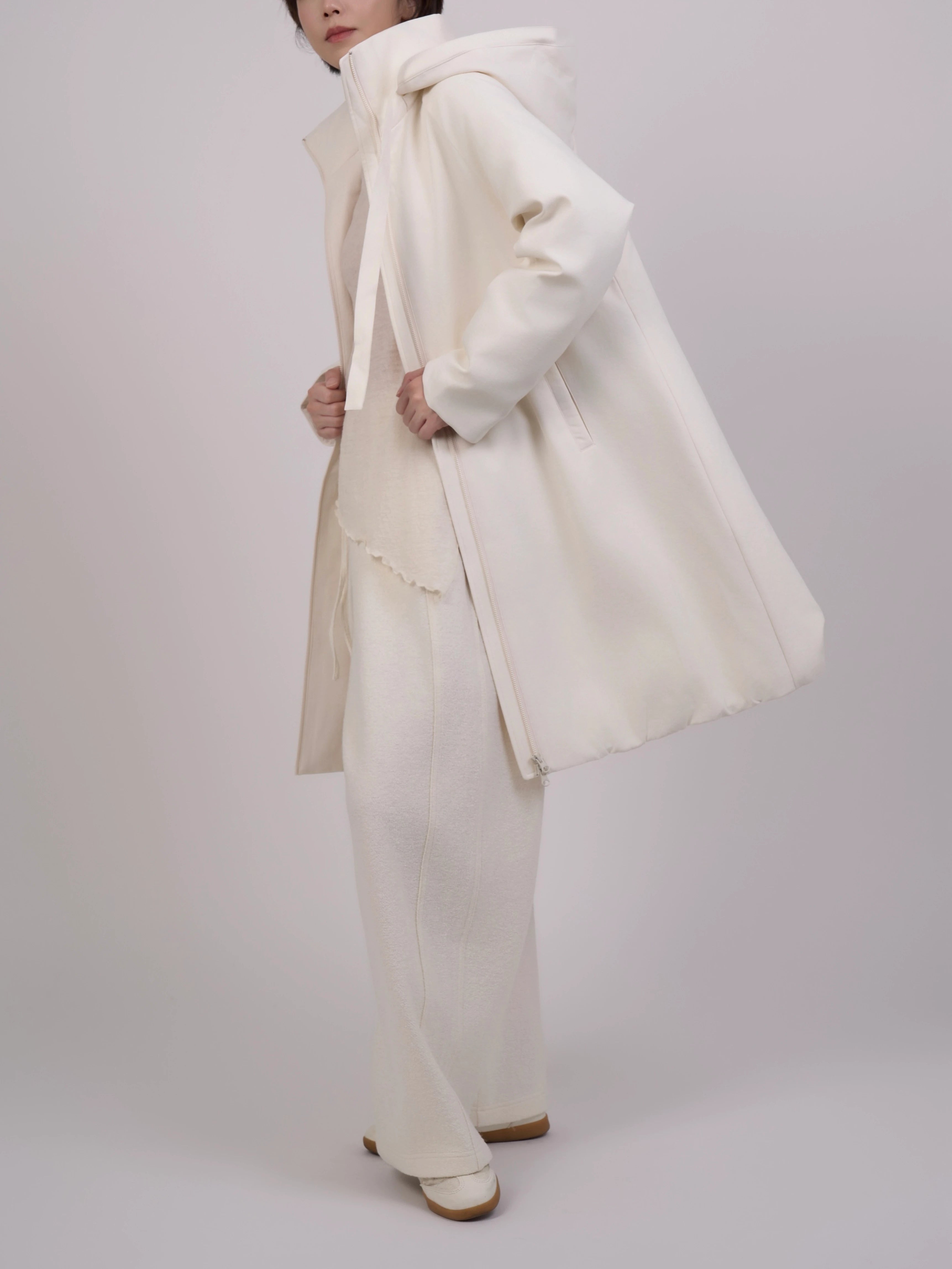 Back view of Off-White Hooded Down Coat displaying long-line shape and clean construction.