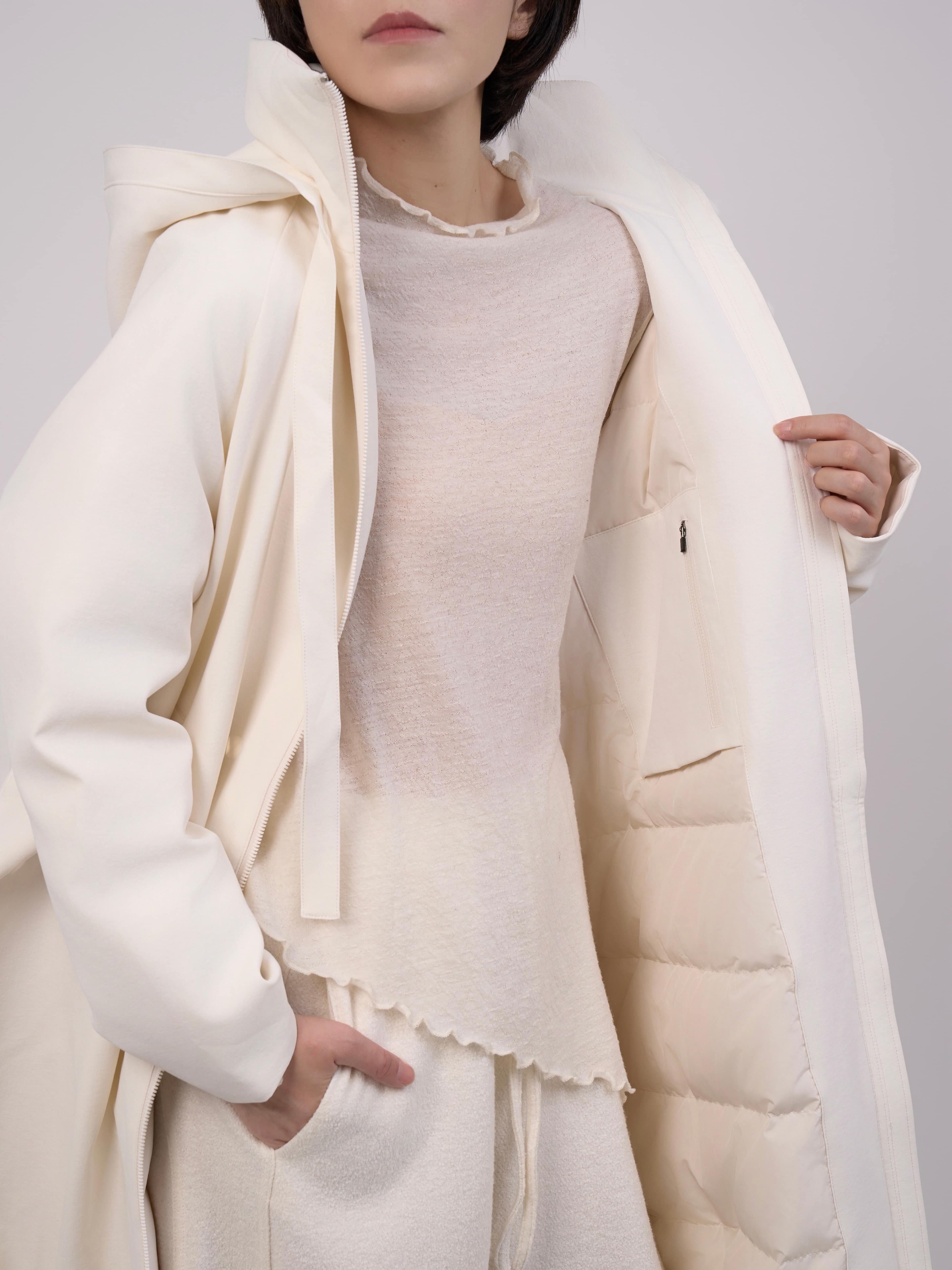 Close-up of Off-White Hooded Down Coat hood and shoulder area showing textured fabric and padding.