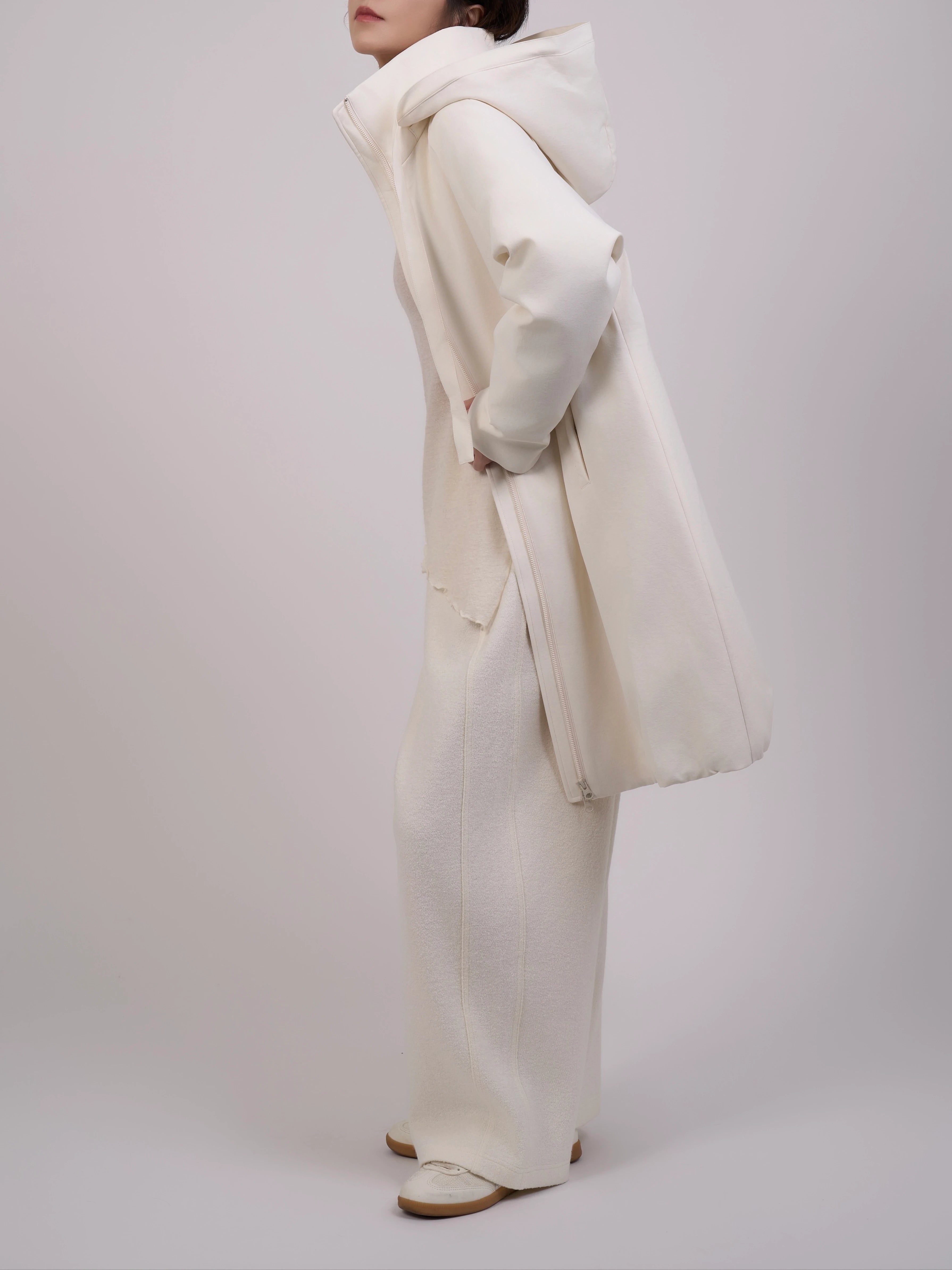 Side view of Off-White Hooded Down Coat showing relaxed silhouette and hood design.