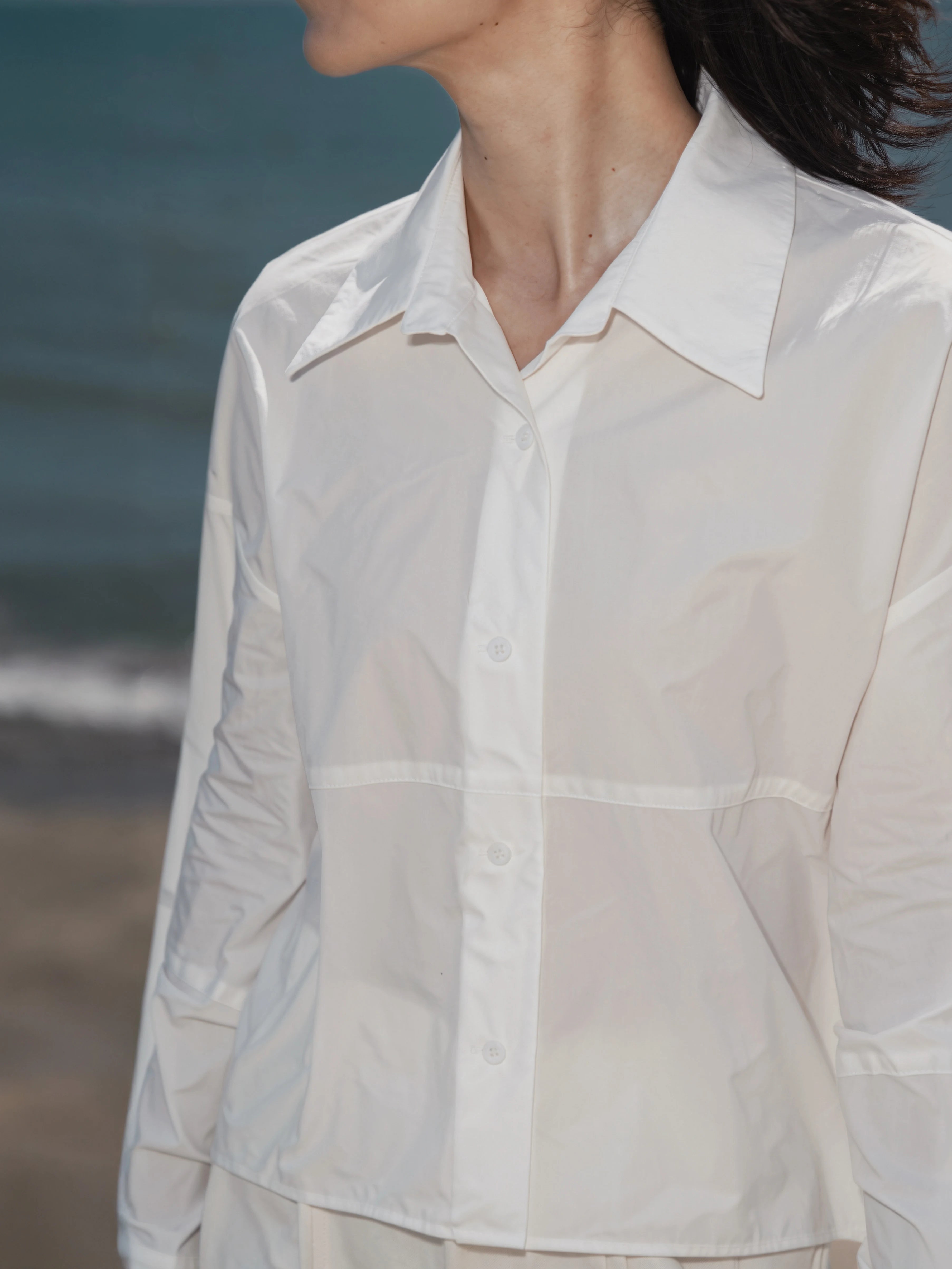 Close-up of the oversized cuff detail on the Pima Boxy Shirt in Soft Cream.