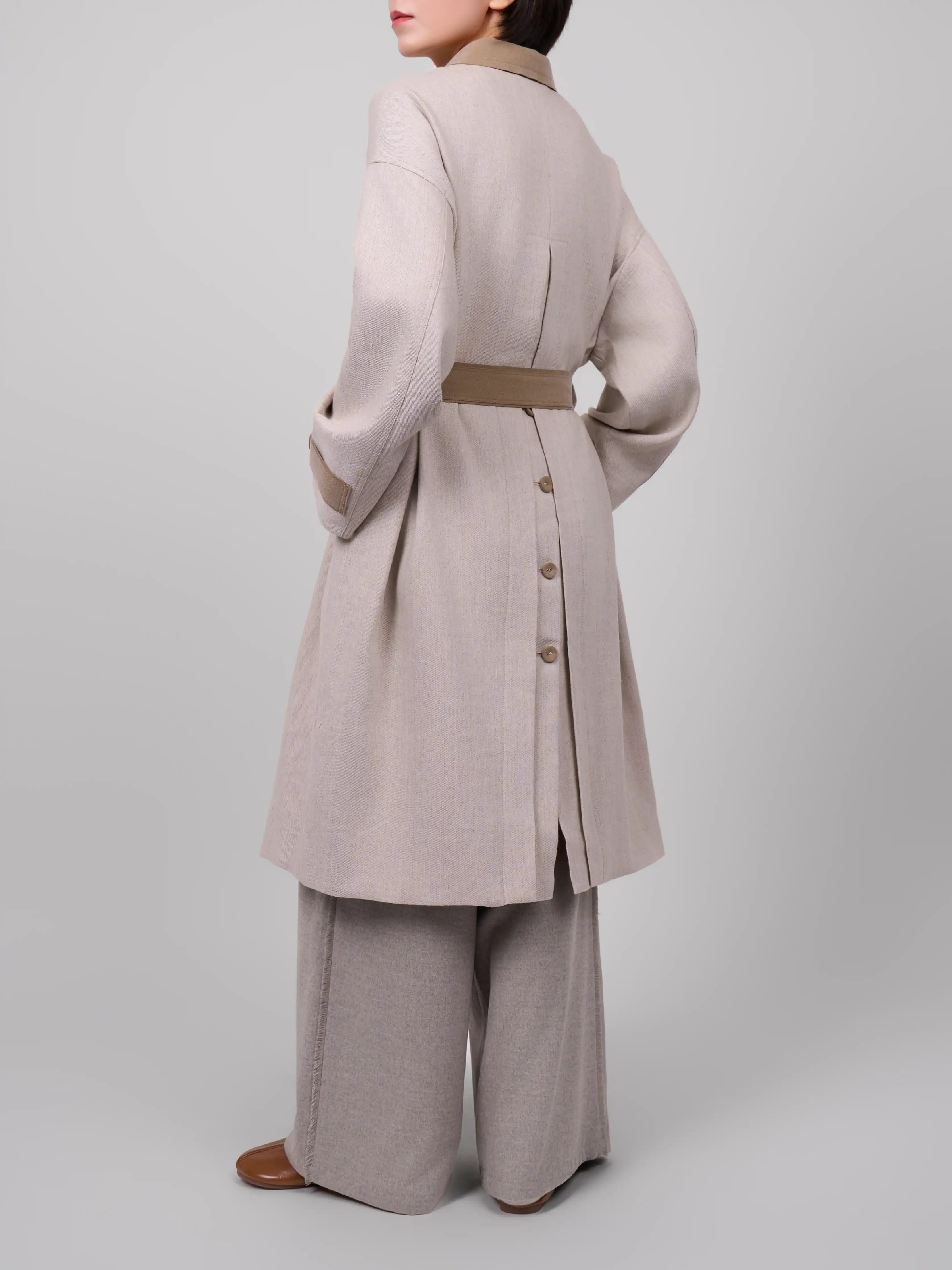 Back view of beige linen wool coat by XXLsmile showing clean straight silhouette and adjustable waist belt