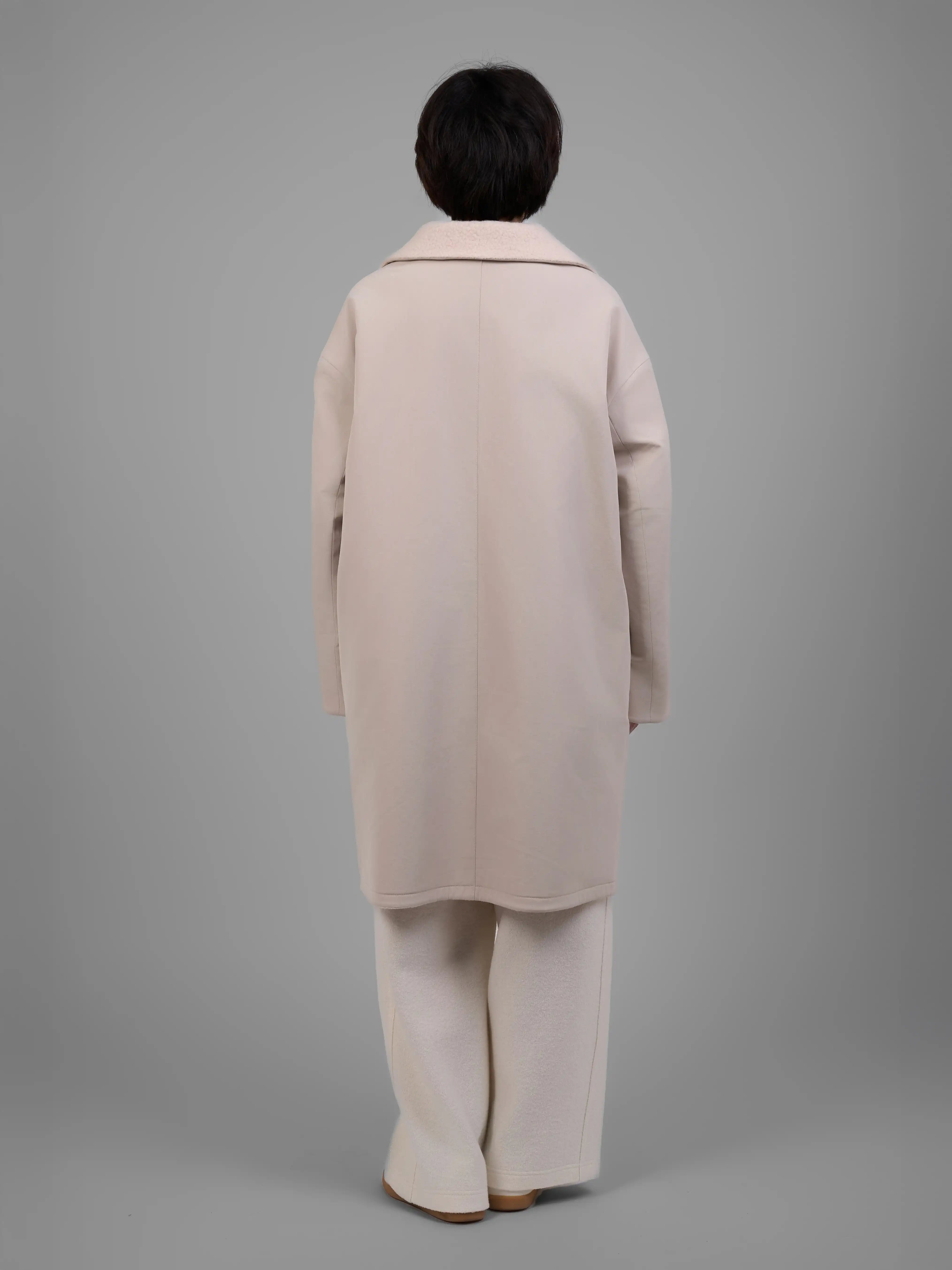 Back view of XXLsmile reversible wool coat in cream showing straight oversized silhouette