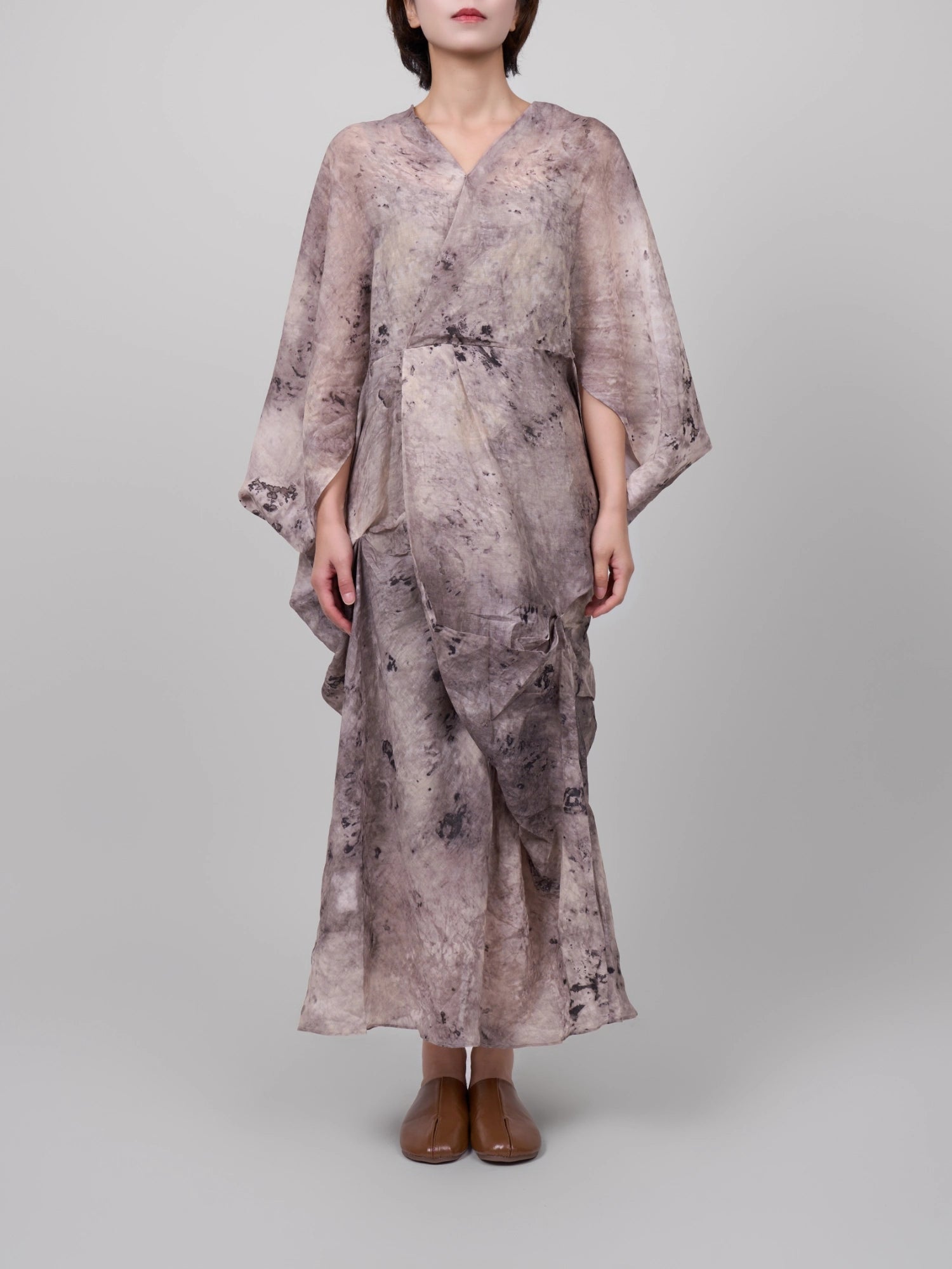 Front view of Tang Ramie Flowing Dress in ink grey, clean wrap front and elongated silhouette in studio light.