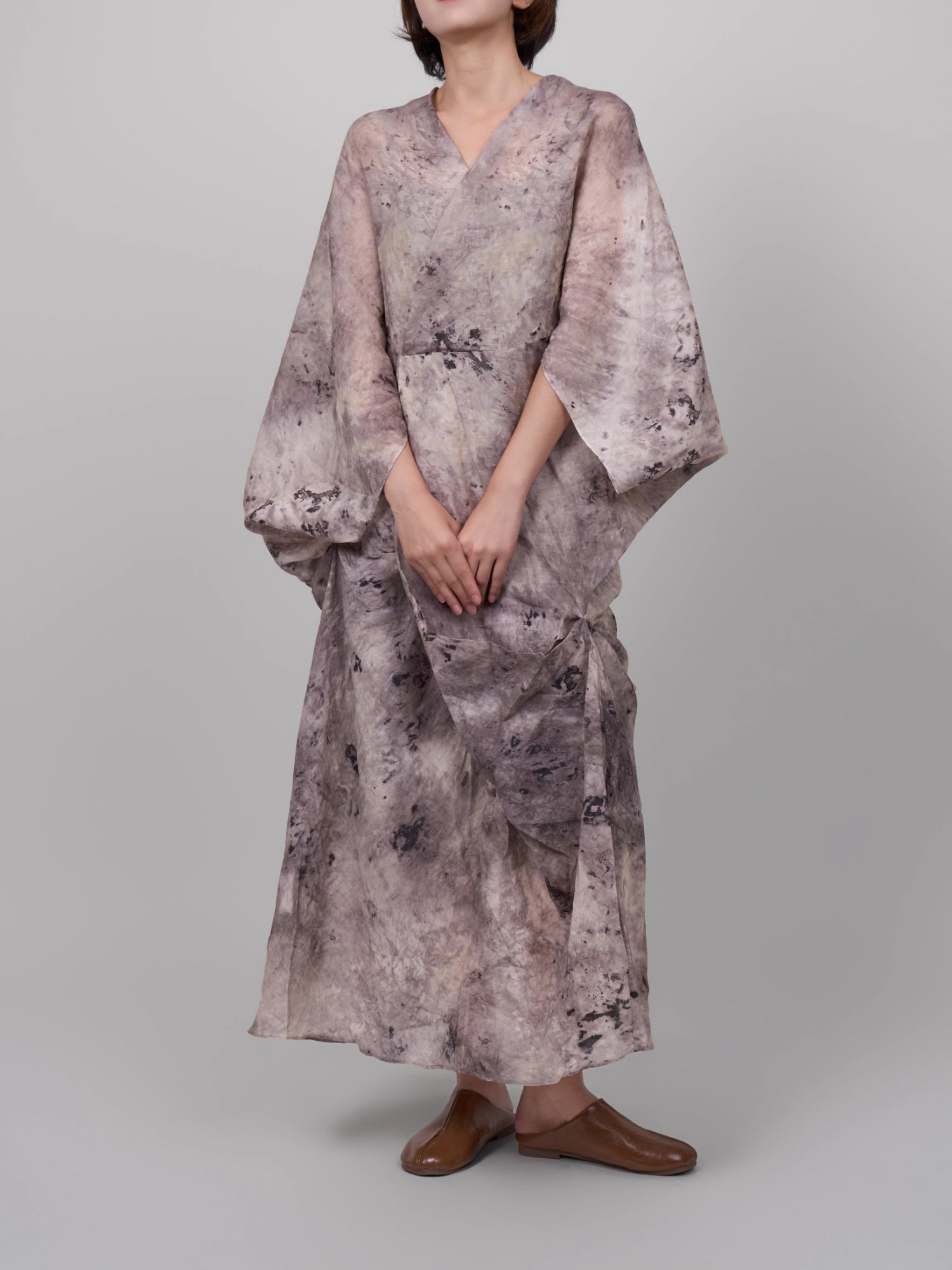 Model wearing Tang Ramie Flowing Dress in ink grey, full-body studio shot showing airy ramie drape and relaxed sleeves.