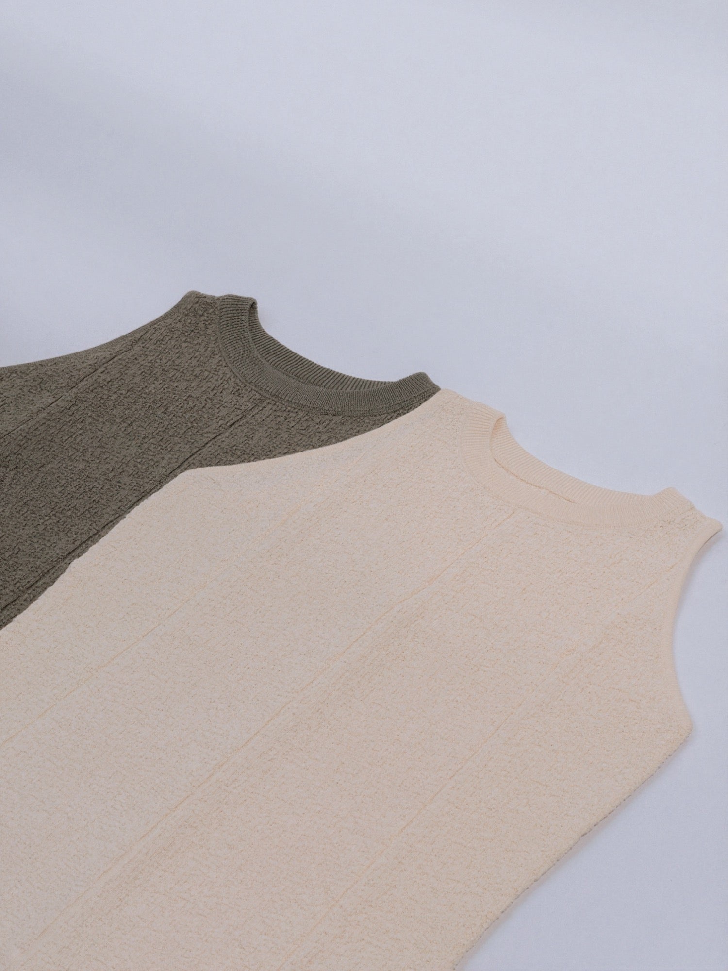 The Textured Knit Shell available in Muted Sage and Soft Cream.
