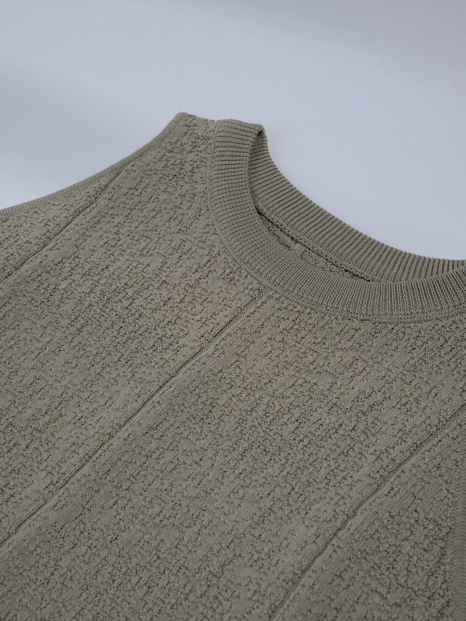 Close-up of the textured knit fabric on the Textured Knit Shell in Muted Sage.