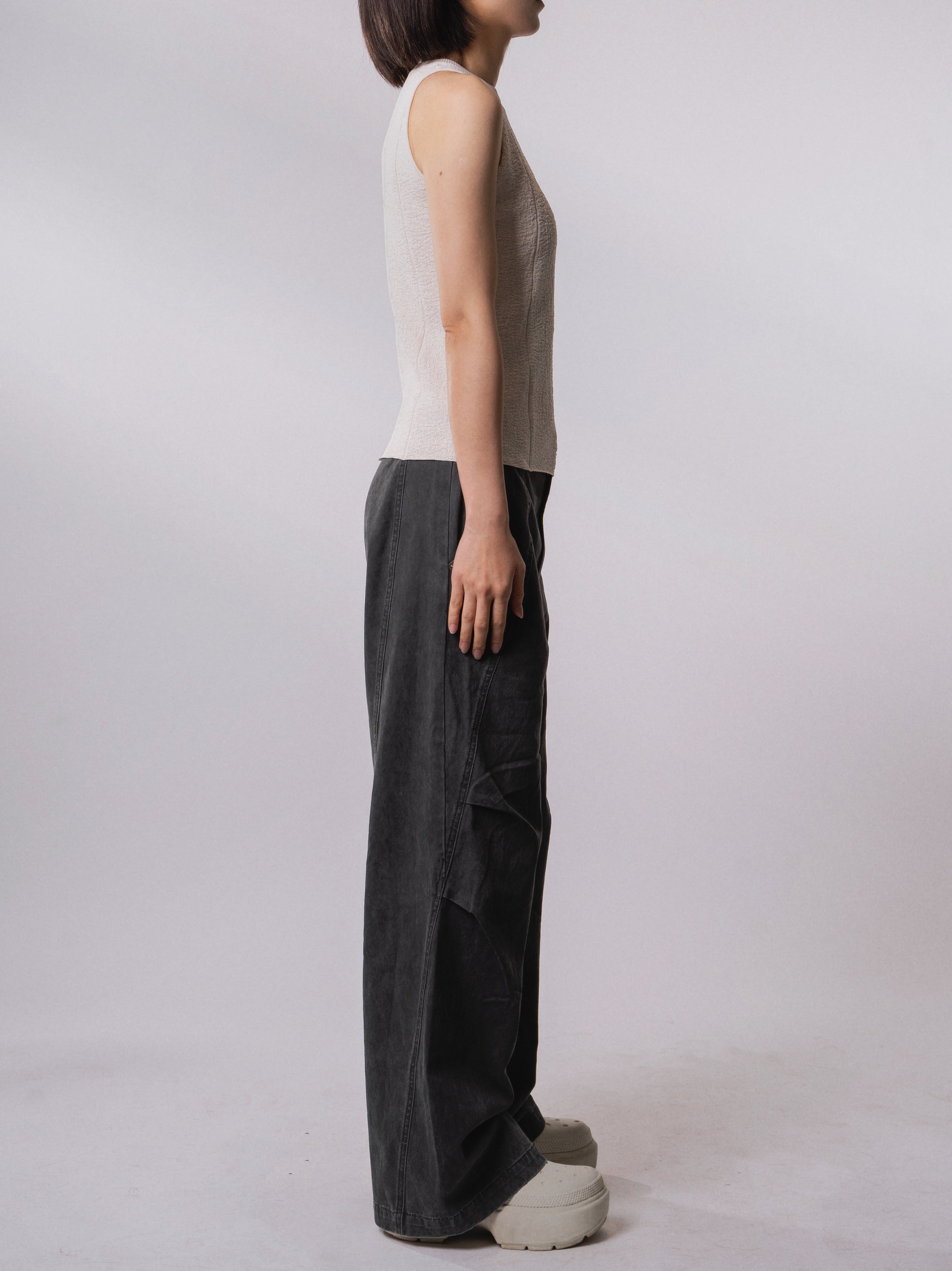 Side view of the Textured Knit Shell in Soft Cream highlighting the sleeveless silhouette.