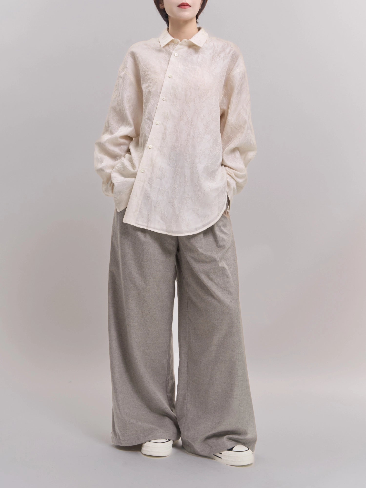 Model wearing white Textured Shirt in cocoon silhouette, full-body studio shot showing soft lyocell–cotton drape.