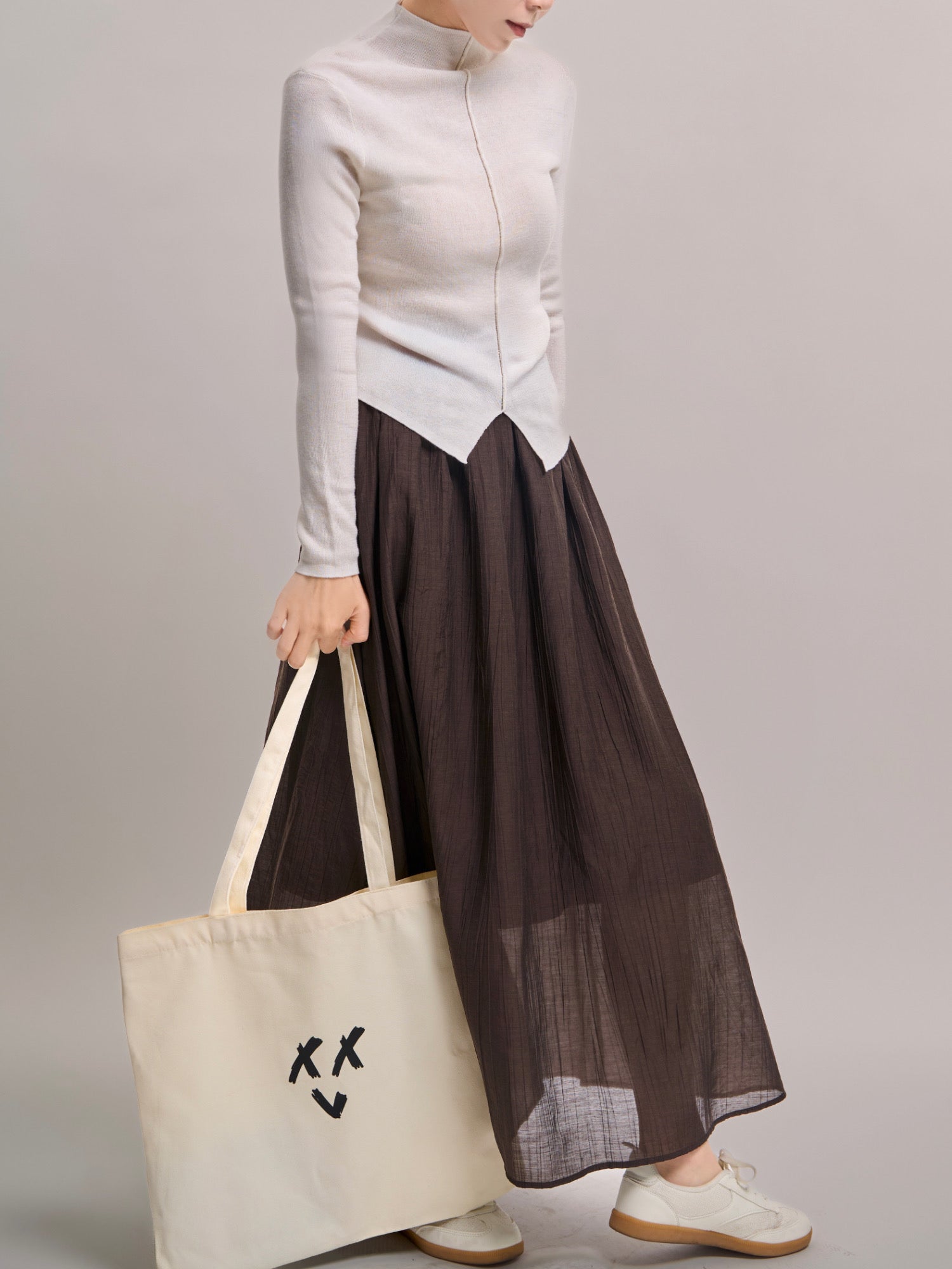 Side view of Veil Pleats Skirt showing fluid movement and soft airy layers.