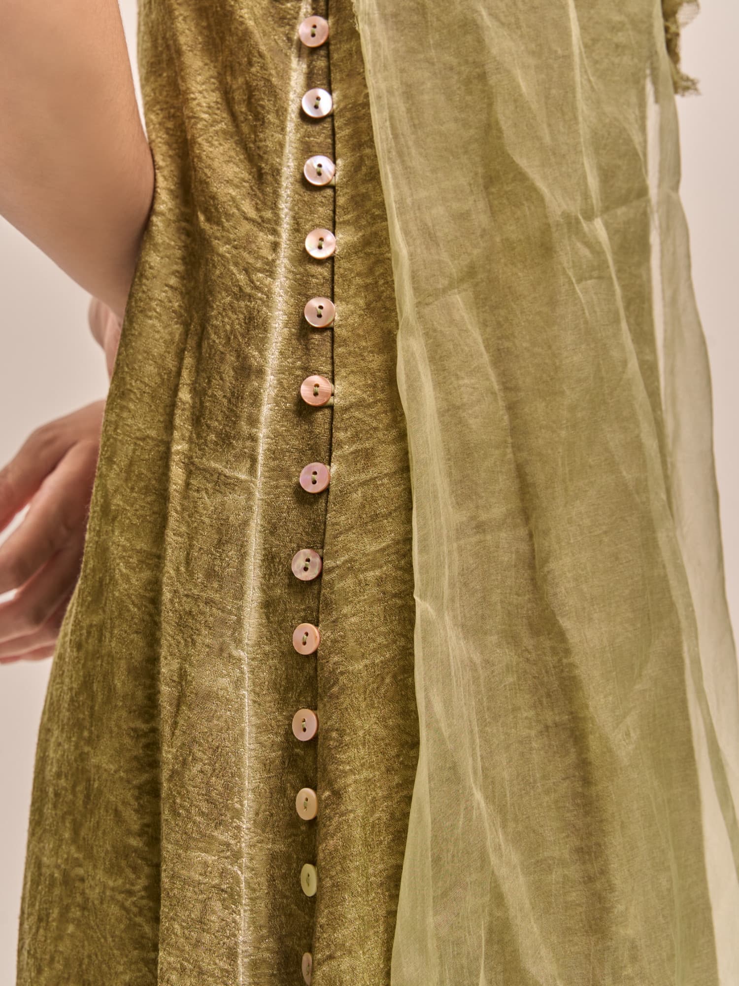 Close-up of Verdant Veil Dress side-button detail inspired by modern Chinese simplicity.
