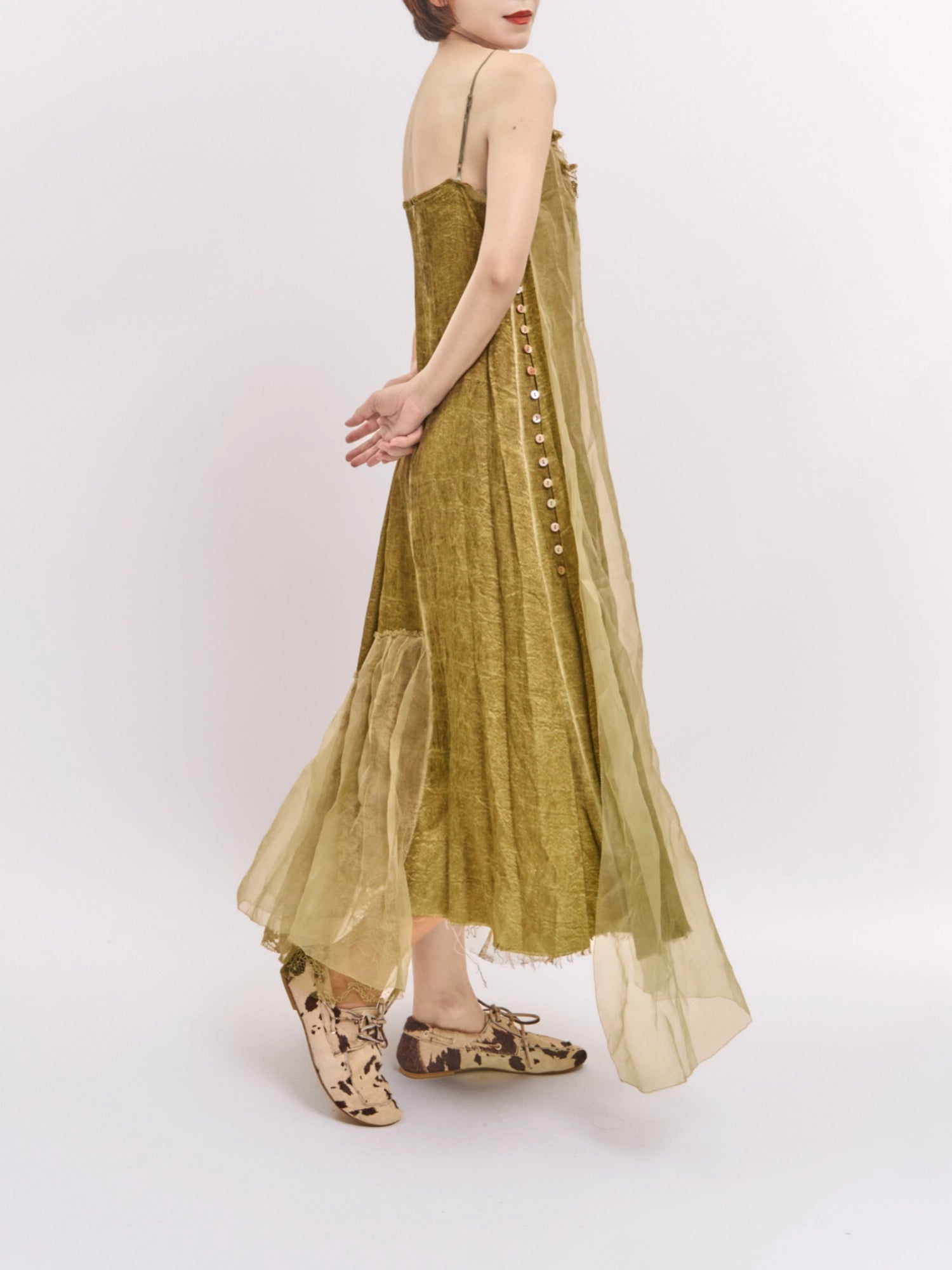 Side-back angle of Verdant Veil Dress showing soft movement and layered mulberry silk finish.