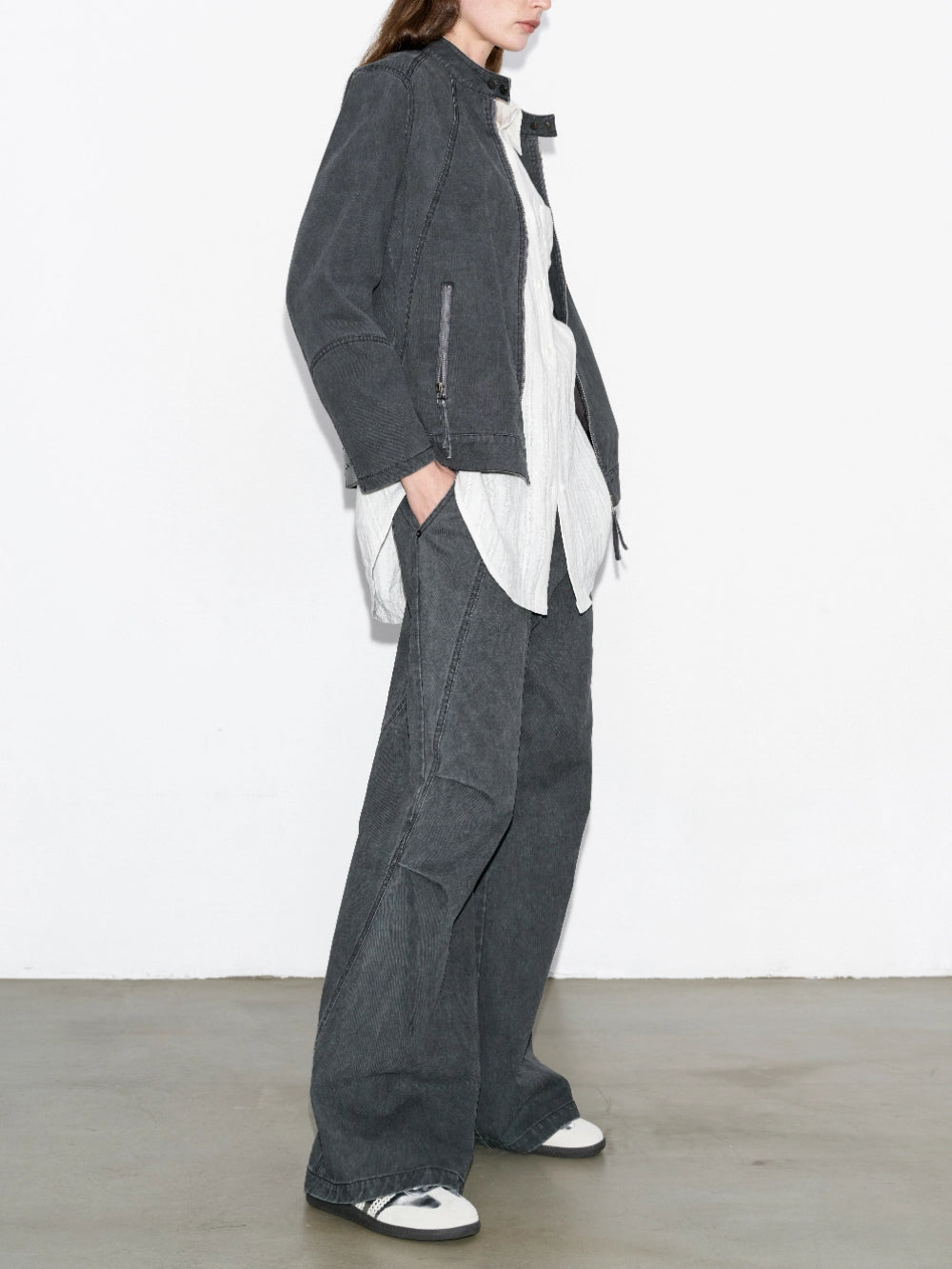 Styled look with washed paratrooper jeans layered with shirt and outerwear, urban casual outfit.