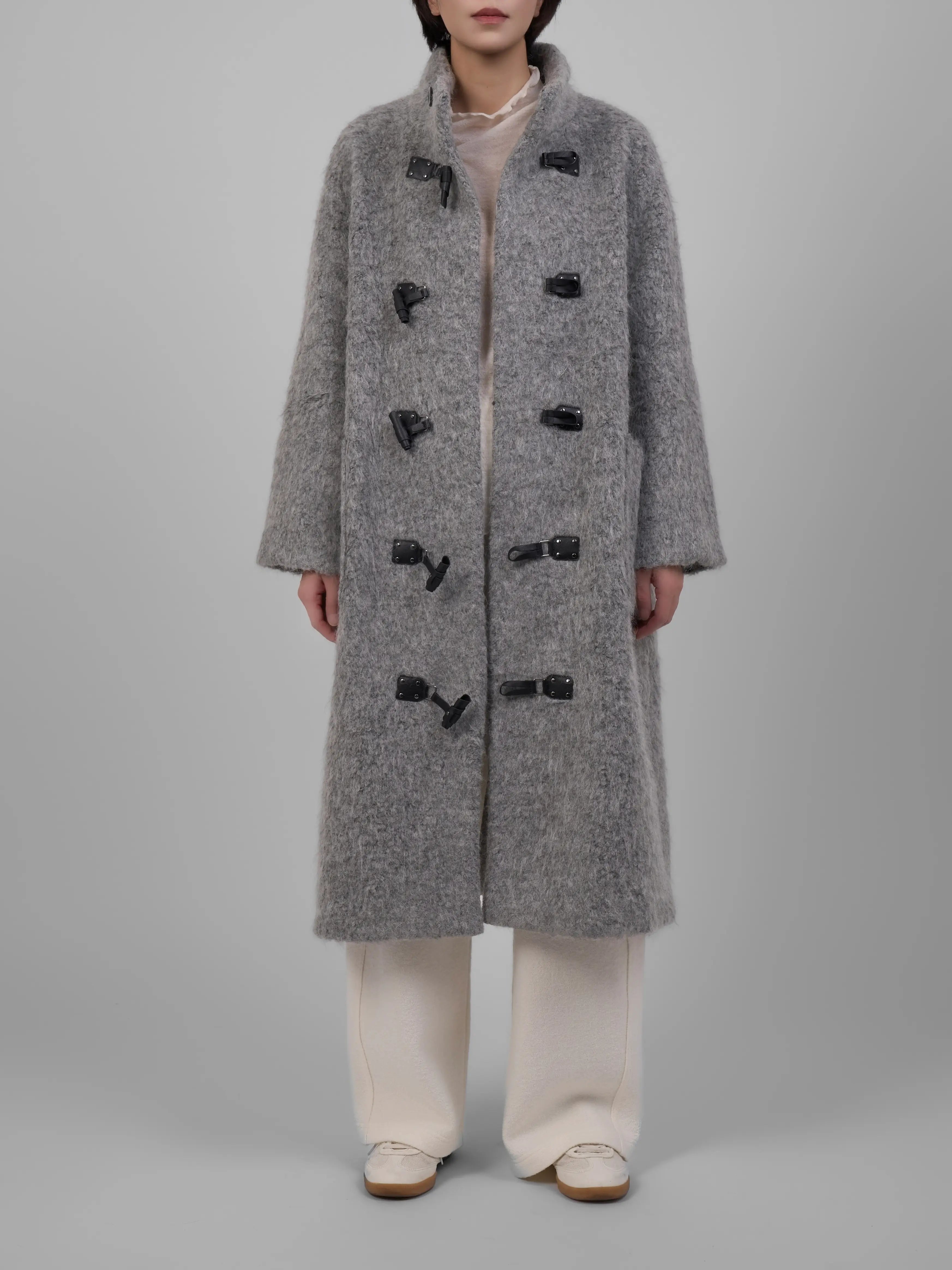 Model wearing XXLSMILE Grey Wool Toggle Coat, front view showcasing classic toggle fastening and long wool silhouette.